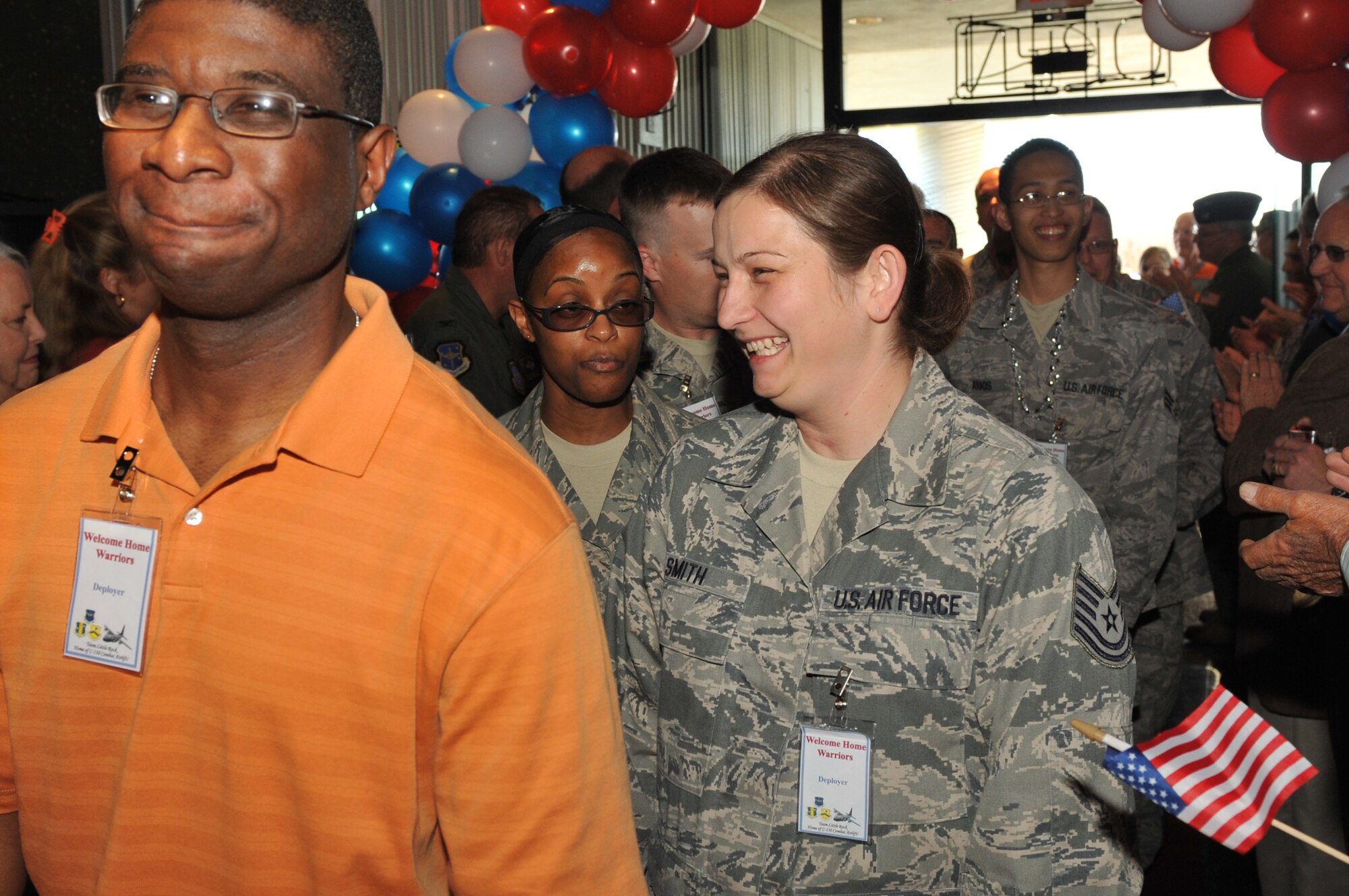 Members of Team Little Rock who recently returned from deployments are greeted by friends and family at the Welcome Home Warriors event April 1, 2011, at Little Rock Air Force Base, Ark. The Welcome Home Warriors event is designed to recognize individual deployers who returned home through Little Rock National Airport and were not part of a large group returning to the base. (U.S. Air Force photo by Airman 1st Class Rusty Frank)