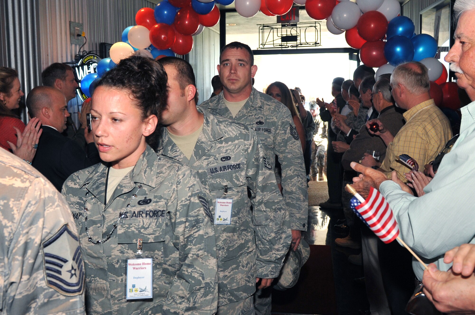 Members of Team Little Rock who recently returned from deployments are greeted by friends and family at the Welcome Home Warriors event April 1, 2011, at Little Rock Air Force Base, Ark. The Welcome Home Warriors event is designed to recognize individual deployers who returned home through Little Rock National Airport and were not part of a large group returning to the base. (U.S. Air Force photo by Airman 1st Class Rusty Frank)