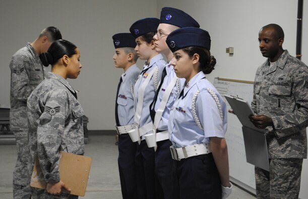 Members of Malmstrom's Honor Guard served as the judges for the Malmstrom Civil Air Patrol six-part evaluation March 26. Here they perform an in-ranks inspection. The judges are Senior Airman Miriam Santiago, 341st Force Support Squadron services chef technician; Airman 1st Class Cory Summers, 341st Civil Engineer Squadron pavement and equipment apprentice; and at rear, Staff Sgt. Elijah Leonard, 341st Maintenance Operations Squadron controller. (U.S. Air Force photo/Airman Cortney Hansen)