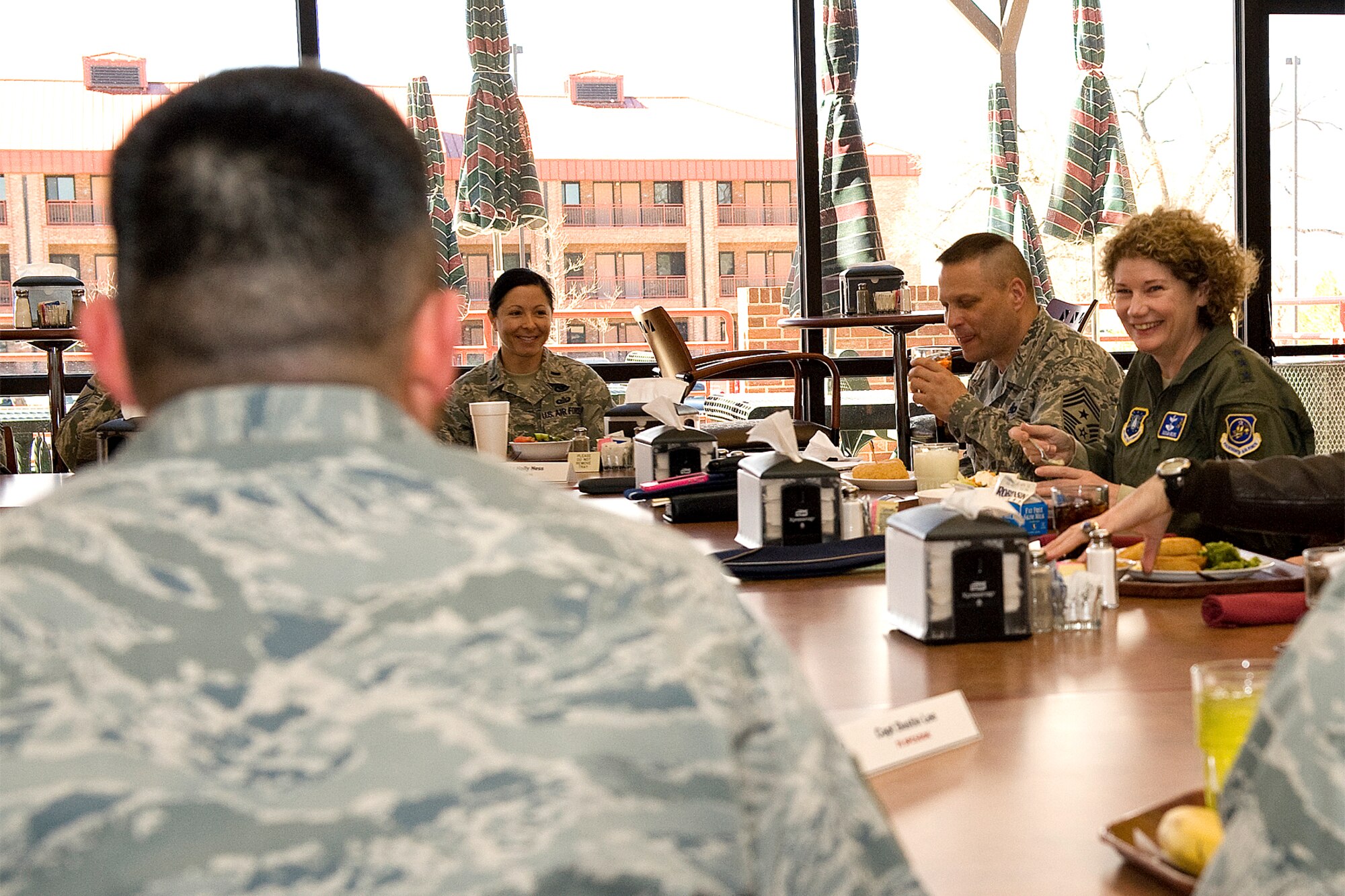 PETERSON AIR FORCE BASE, Colo. – Lt. Gen. Susan J. Helms, 14th Air Force commander (right), and Chief Master Sgt. James MacKinley, 14th Air Force command chief, met with 21st Space Wing Airmen for lunch March 31 at the Aragon Dining Facility on Peterson Air Force Base. General Helms’ visit to Peterson included a briefing with Col. Stephen N. Whiting, 21st Space Wing commander, tours of the 16th and 76th Space Control Squadrons and lunch with the 21st Space Wing’s annual award winners and professional performers from the recent Operational Readiness/Unit Compliance Inspection. (U.S. Air Force photo/Craig Denton)