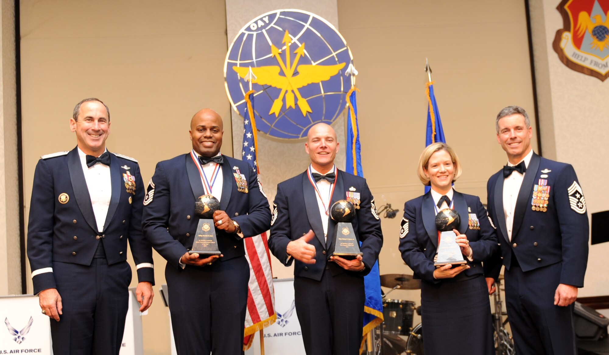 SCOTT AIR FORCE BASE, Ill -- Gen. Raymond Johns Jr., commander of Air Mobility Command, (left) and AMC Command Chief David Spector, (right) flank this year’s award winners: Senior Master Sgt. Patrick Jones, Scott Air Force Base, won the Senior NCO category, Master Sgt. Michael Moore, Fairchild AFB, Wash., won the 1st Sergeant category, and Master Sgt. Tonya Hubbard, Travis AFB, Calif., won the NCO category.  Not pictured is Senior Airman Kristina Zacherl, MacDill AFB, Fla., who won the Airman category. (U.S. Air Force photo/ Airman 1st Class Divine Cox)