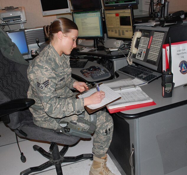 Senior Airman Tonya Saenz completes some of her daily paperwork. She is one of only three Airmen selected to work with the noncommissioned officers that staff the BDOC. She was also selected as this year's 341st Missile Wing Airman of the Year. (U.S. Air Force photo/Valerie Mullett)