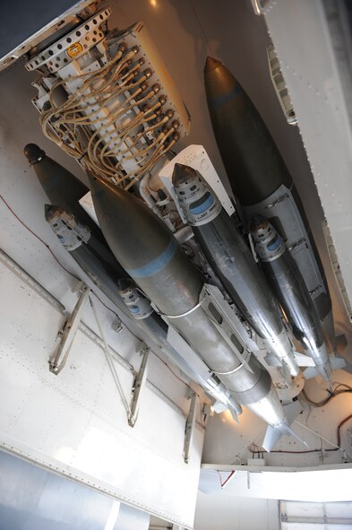 DYESS AIR FORCE BASE, Texas — An assortment of 500-pound and 2,000-pound Joint Direct Attack Munitions are connected to a Multiple Ejector Rack March 31 on a B-1 at the weapons load barn here.  If fielded, a 16-carry modified rotary launcher will increase the number of 500-pound Joint Direct Attack Munitions and Laser Guided JDAMS carried by the B-1 from 15 to 48, a 320 percent increase in capability. (U.S. Air Force photo/ Airman 1st Class Shannon Hall)