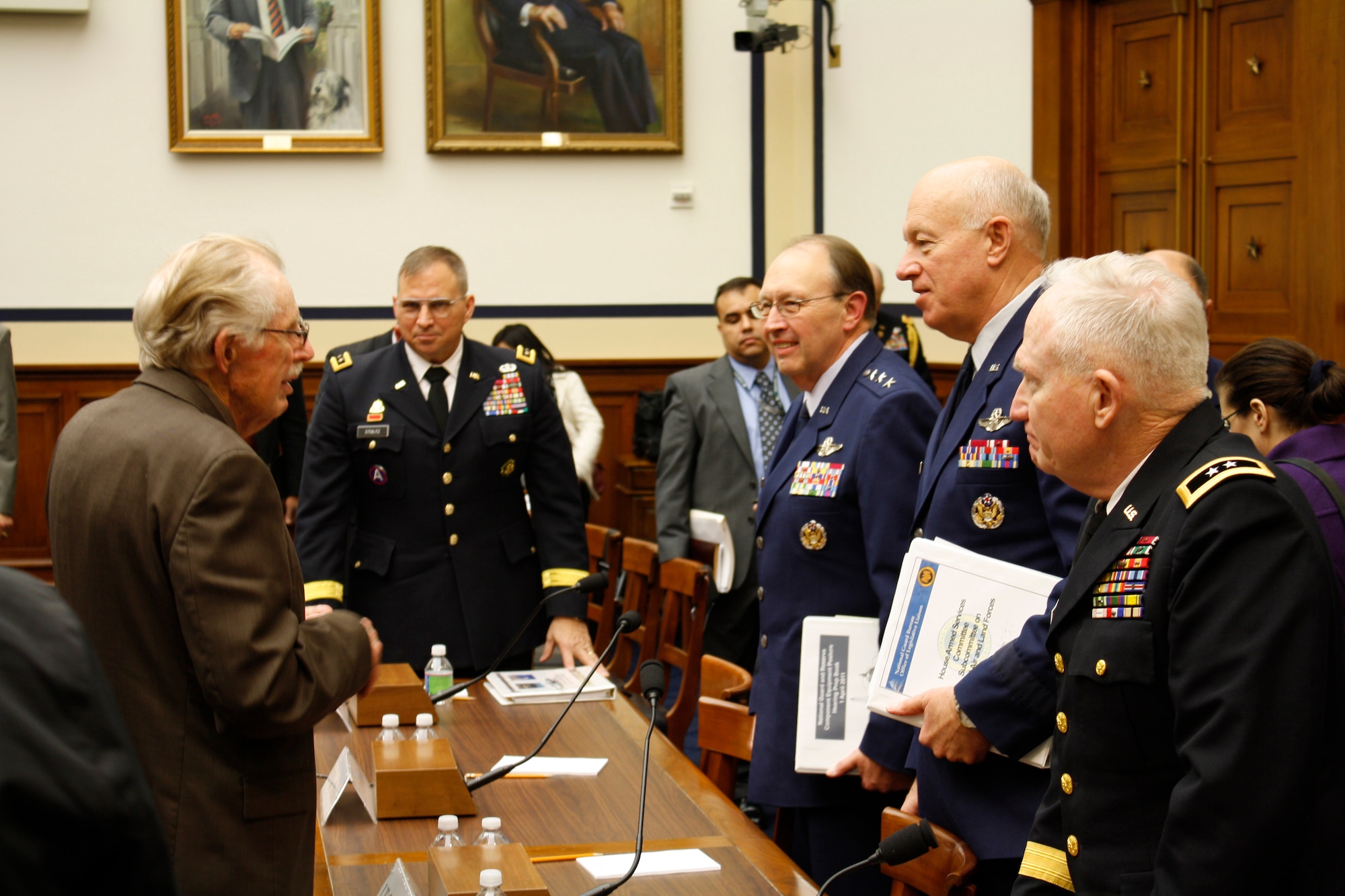 After a House Armed Services Committee hearing, Congressman Roscoe Bartlett (R-6-MD), on left, greets leaders of the Army and Air Force Reserve and National Guard on April 1.  The Reserve Component chiefs testified and discussed equipment and budget needs with the congressional Subcommittee on Tactical Air and Land Forces.  Testimonies were heard from Lt. Gen. Jack C. Stultz, chief of Army Reserve; Lt. Gen. Charles E. Stenner Jr., chief of Air Force Reserve and commander of Air Force Reserve Command; Lt. Gen. Harry M. Wyatt III, director of the Air National Guard; and Maj. Gen. Raymond W. Carpenter, director of Army National Guard.  (U.S. Air Force photo/Col. Bob Thompson)