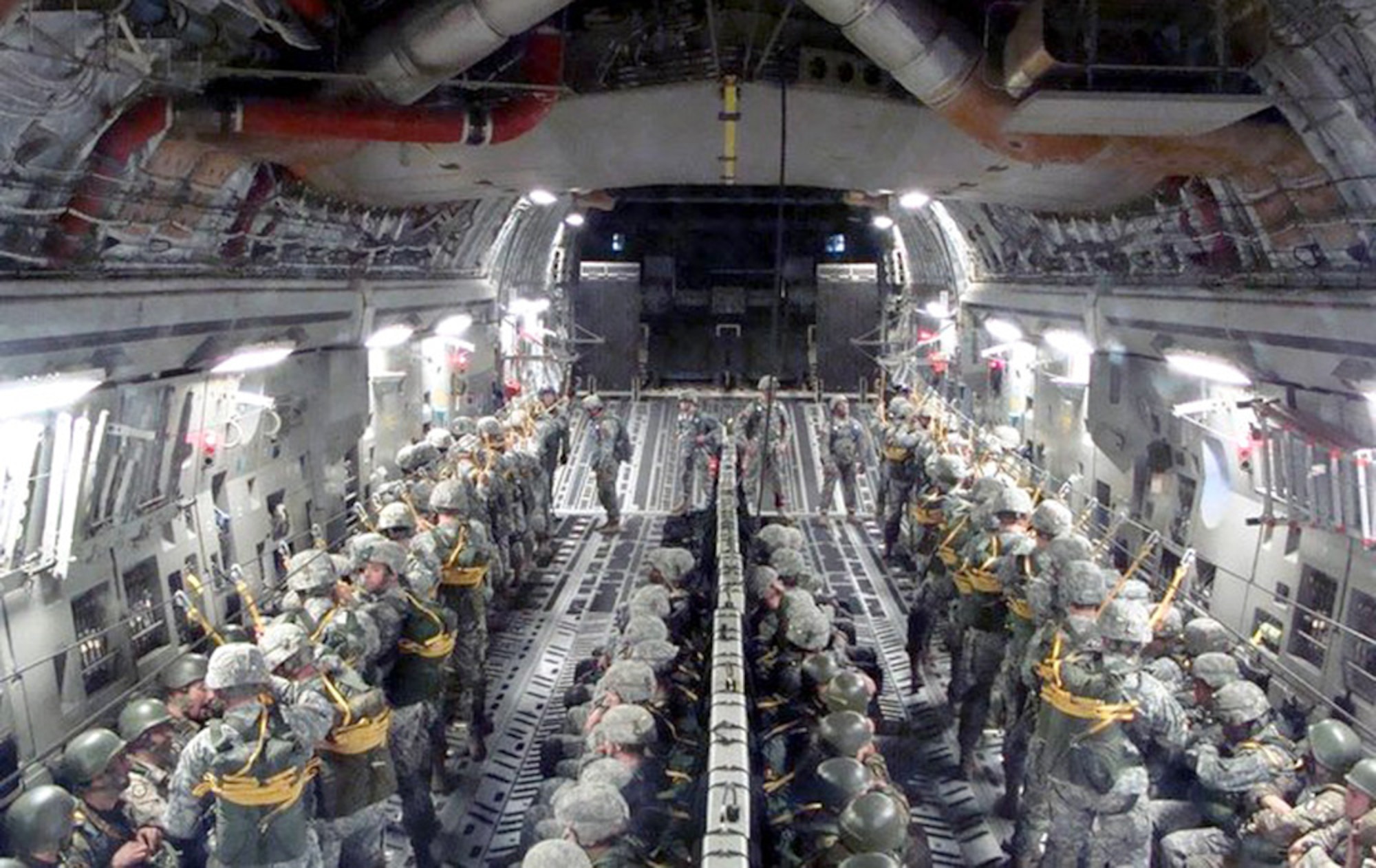 Paratroopers from the U.S. Air Force, the U.S. Army and the Italian army prepare for a jump from a C-17 Globemaster III March 31, 2011, above Italy. (U.S. Air Force photo/1st Lt. Maria Amistoso)