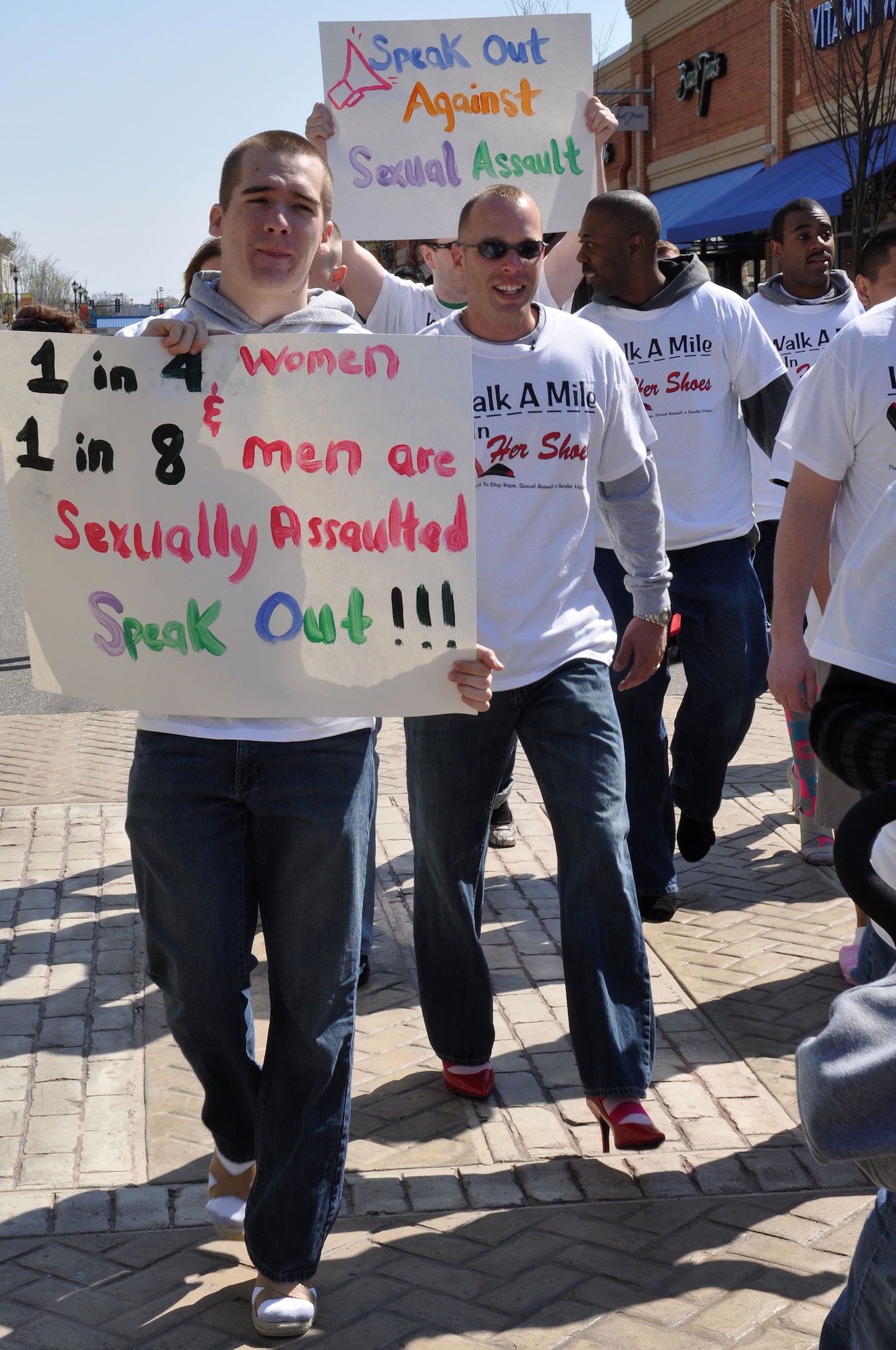 Airmen assigned to the 633d Communications Squadron, raise awareness to sexual violence by walking a mile in women’s shoes during Sexual Assault Awareness month in Hampton, Va., April 2, 2011. The annual march is a “fun way for men to show their support in the fight to end sexual violence” during Sexual Assault Awareness month. (U.S. Air Force Photo/Tech. Sgt. Christina M. Styer/RELEASED)  