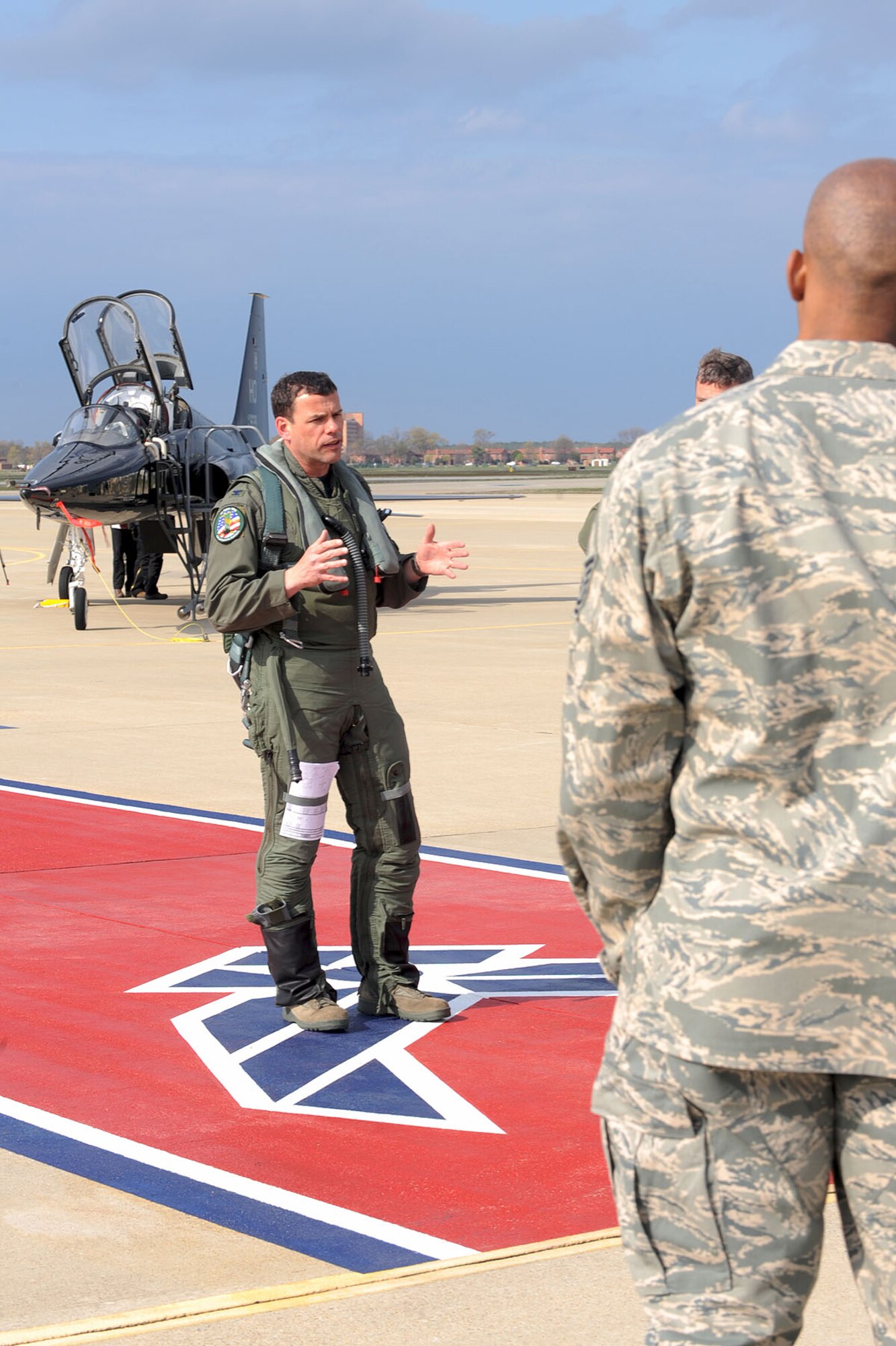 Matthew Molloy, 1st Fighter Wing Commander, addresses members of Team Langley after escorting the T-38 Talon to Langley Air Force Base, Va., April 1, 2011. The aircraft was flown here to help train 1st FW pilots and prepare them for when it is permanently stationed here. (U.S. Air Force photo by Staff Sgt. Ashley Hawkins/Released)
