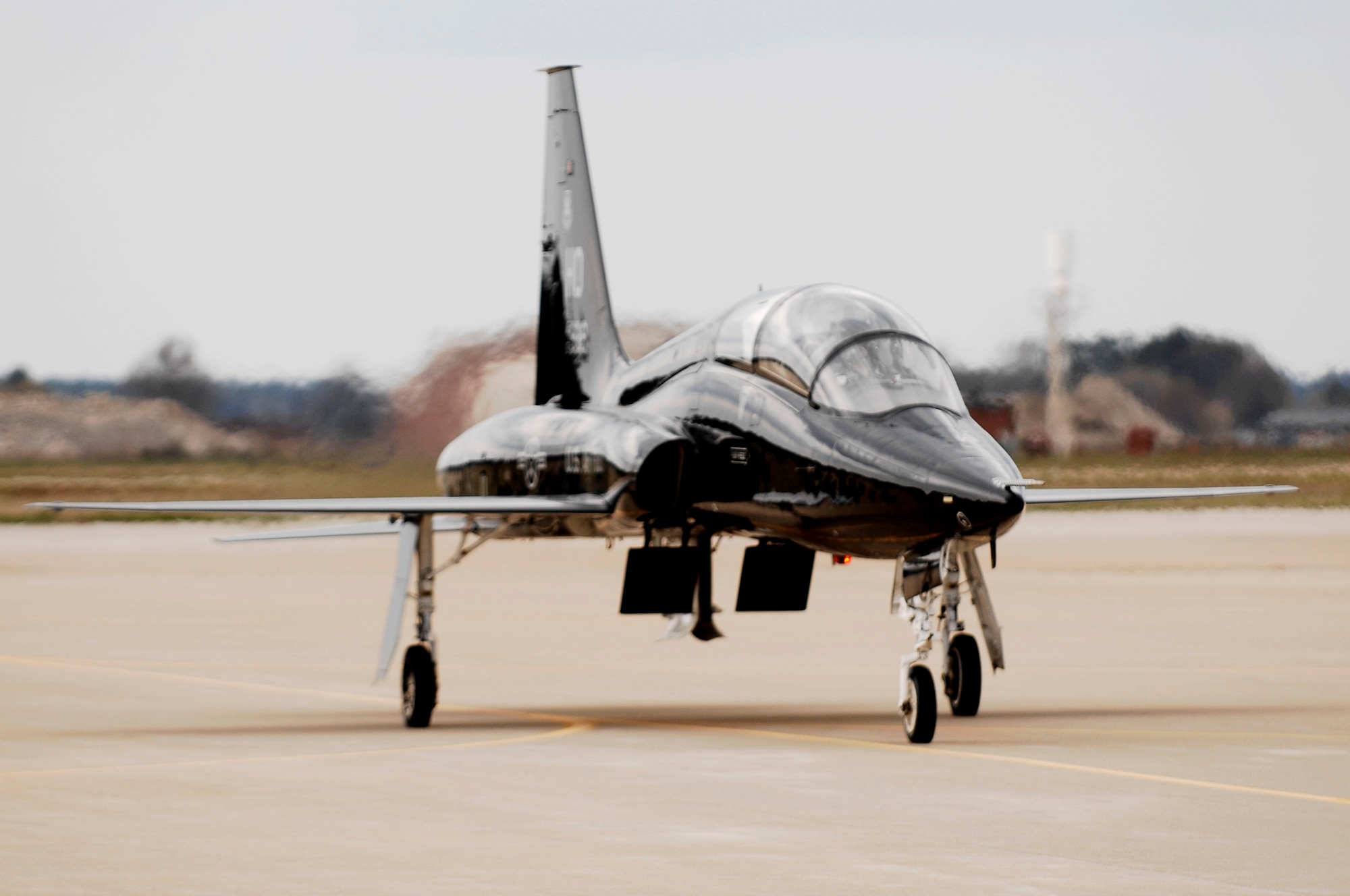 The T-38 Talon arrives at Base Ops at Langley Air Force Base, Va., April 1, 2011. The T-38 Talon is one of seven coming to Langley AFB to support F-22 Raptor Combat Readiness Training. (U.S. Air Force photo by Airman 1st Class Kayla Newman/Released)