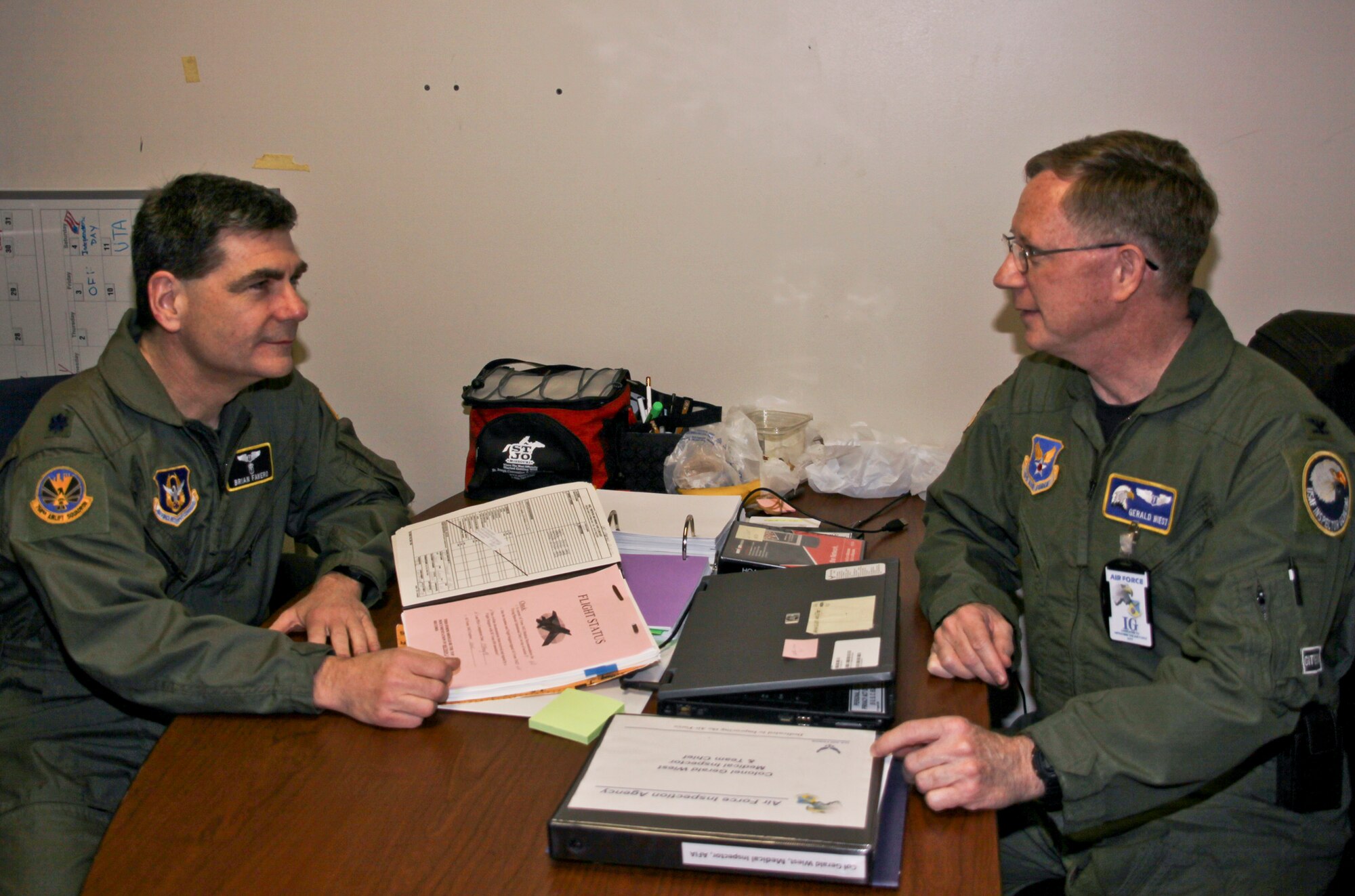 Lt. Col. Brian Favero, 911th Aeromedical Staging Squadron, chief of aerospace medicine, goes over medical records during a health services inspection interview with ASTS’s inspection team chief, Col. Gerald Weist, U.S. Air Force Inspection Agency, April 2. (U.S. Air Force photo/Senior Airman Jonathan Hehnly)
