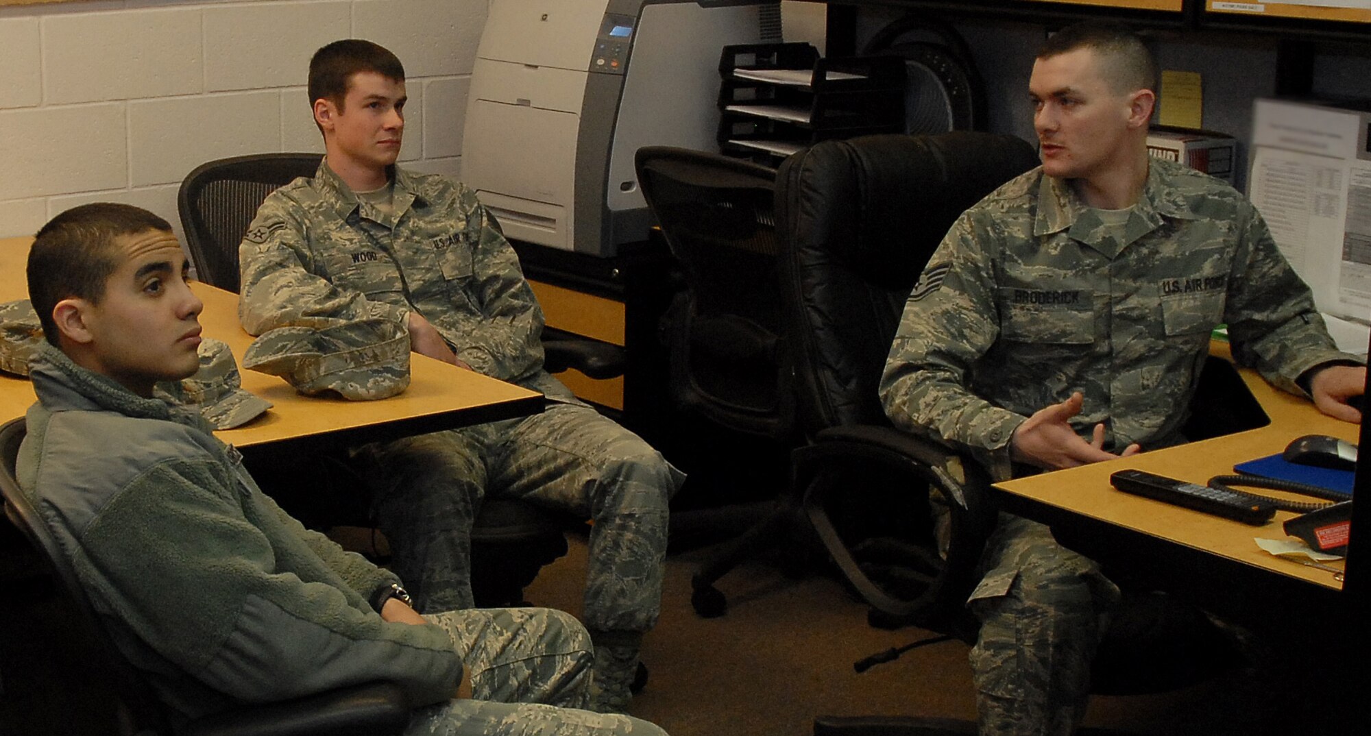 Airmen 1st Class Daniel Garcia, 341st Maintenance Group Facility Maintenance Section team member, and Jacob Wood, Electromechanical Team member, listen to Staff Sgt. James Broderick, 341st MXG driving instructor as he briefs gravel-road training slides March 15. (U.S. Air Force photo/Staff Sgt. Dillon White)