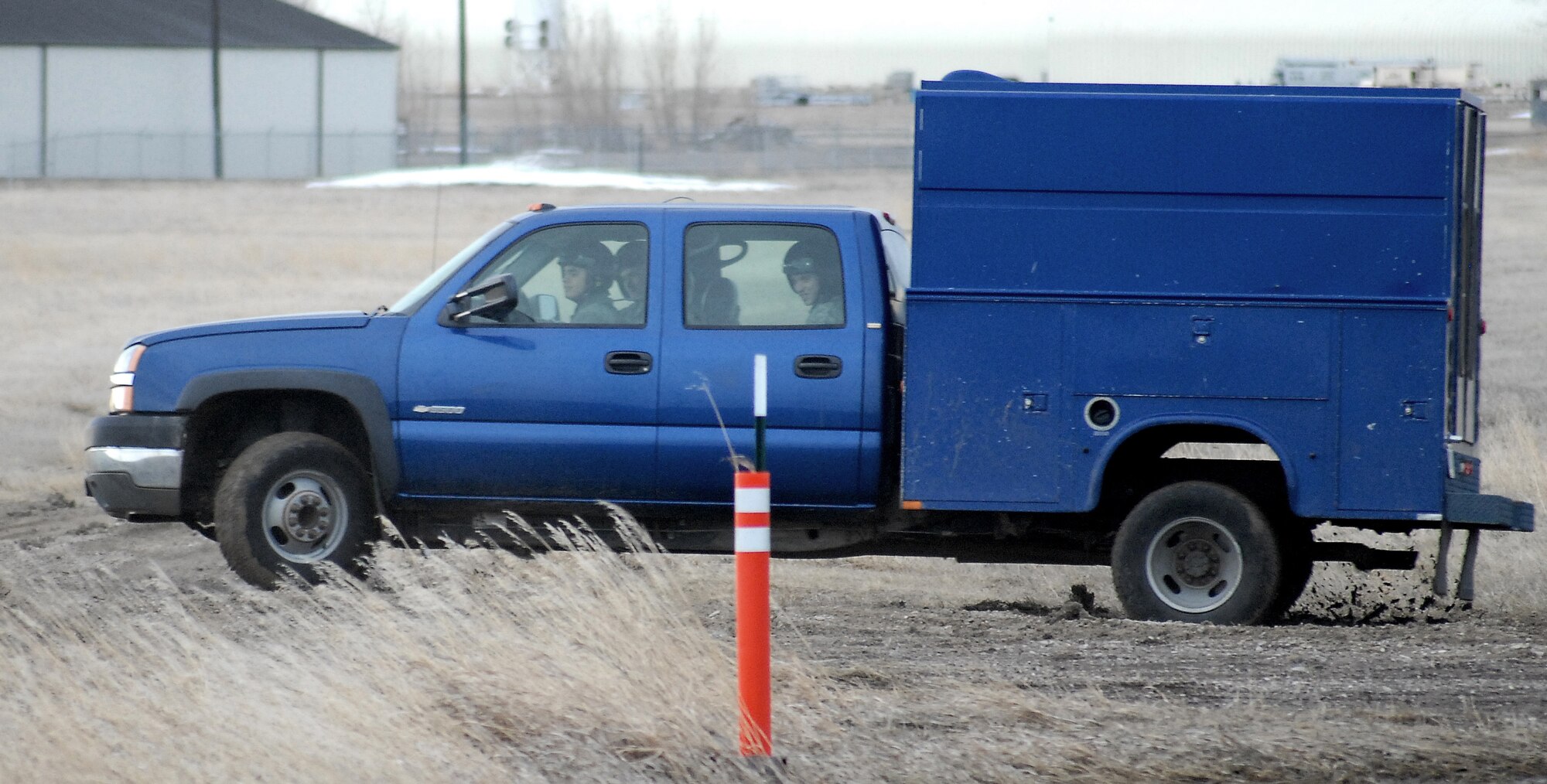 Staff Sgt. James Broderick, 341st Maintenance Group driving instructor, directs a student through the gravel road course March 15. (U.S. Air Force photo/Staff Sgt. Dillon White) 