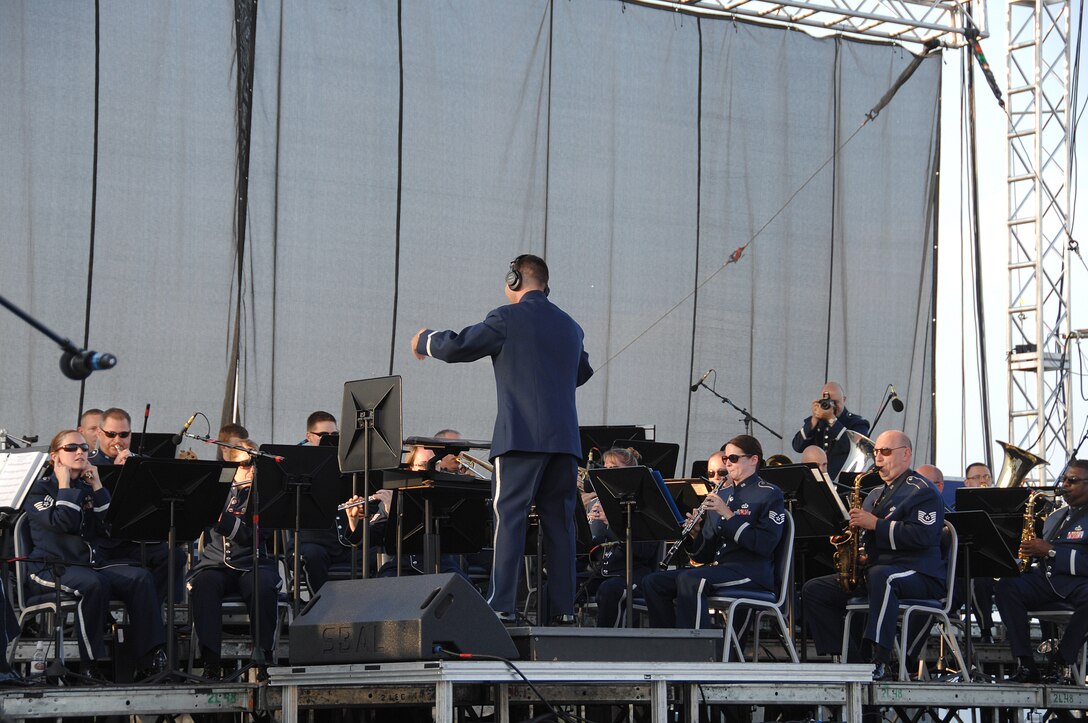Maj. R. Michael Mench conducts the Band of Flight at the 2010 Tattoo on Wright-Patterson Air Force Base, Ohio.  (U.S. Air Force photo/Ben Strasser)
