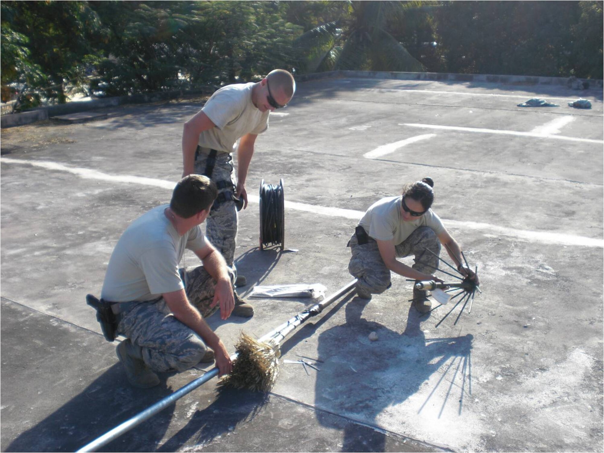 Members from the 1st Special Operations Communication Squadron's Haiti Relief Communicaiton Response Team assemble a home-made antenna. The antenna provided radio support for special operations' personnel and missions. (Courtesy photo)