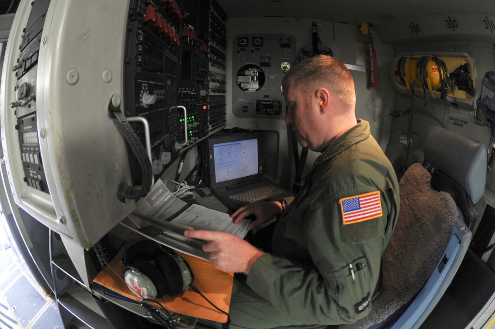YOKOTA AIR BASE, Japan -- Technical Sgt. Ryan Eads, a loadmaster with the 517th Airlift Squadron, goes through pre-flight checks on a C-17 Globemaster III prior to a mission here, April 2. Sergeant Eads and fellow members of the 517th from Joint Base Elmendorf-Richardson, Alaska are providing support to Operation Tomodachi by shuttling supplies to and from other bases around Japan. (U.S. Air Force Photo/ Staff Sgt. Joshua Garcia)