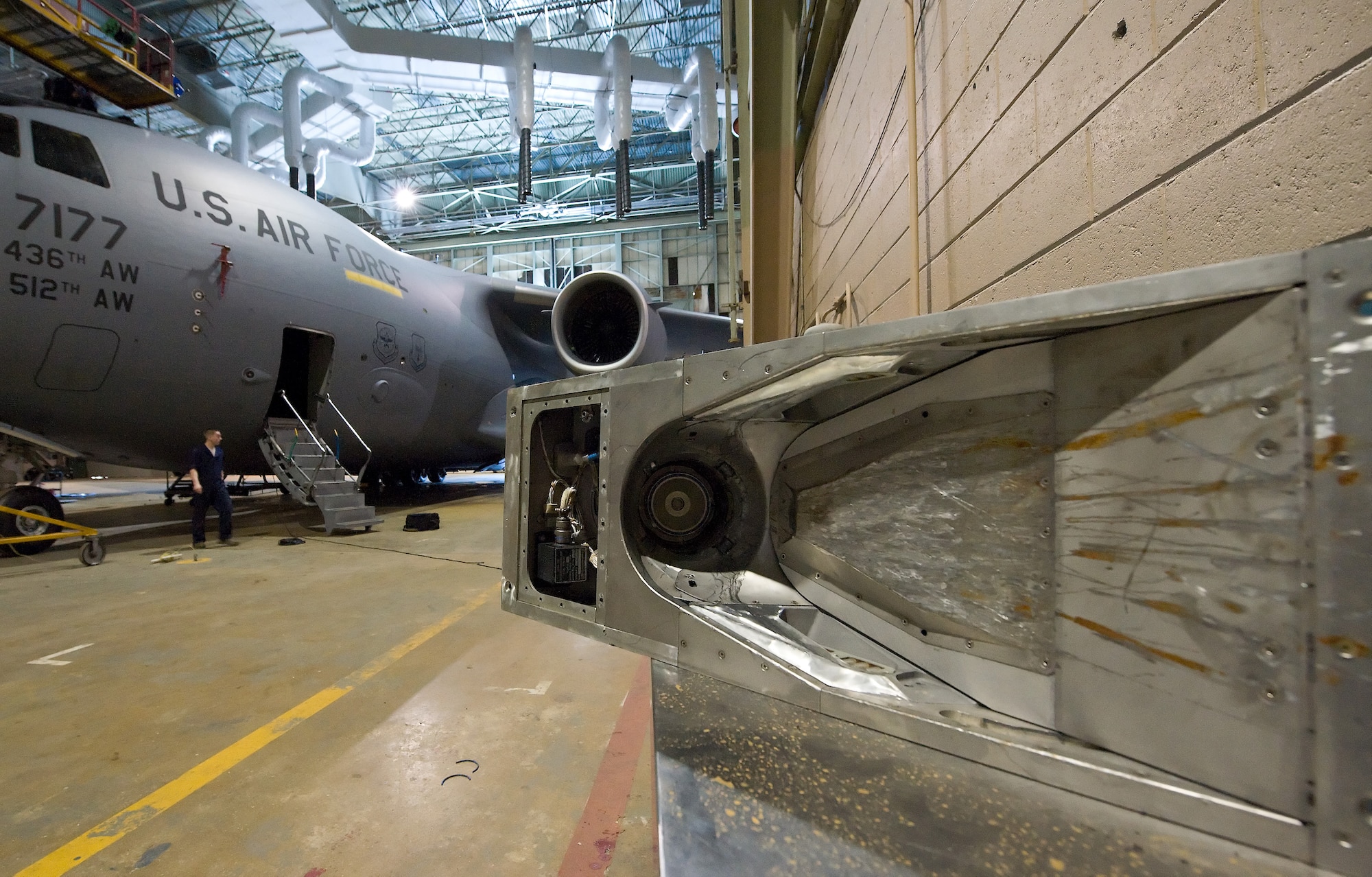 This old universal aerial refueling receptacle slipway installation was taken off this C-17 because of a malfunction March 31, 2011, at Dover Air Force Base, Del. (U.S. Air Force photo by Roland Balik)