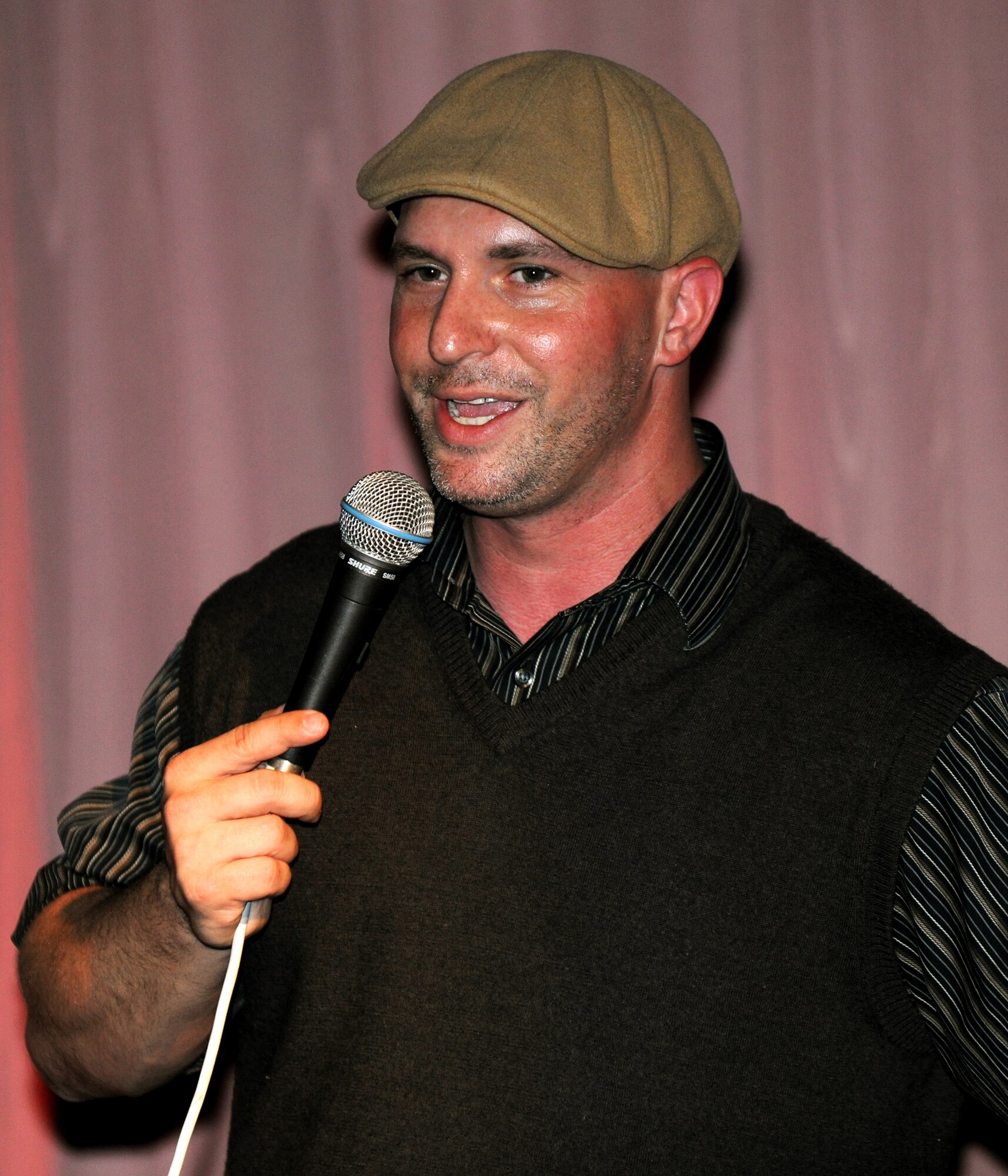 RAF CROUGHTON, United Kingdom - Comedian Bryan Ricci performs for Team Croughton April 2 at the Croughton Crown. Mr. Ricci was part of a team from Armed Forces Entertainment that toured bases in England. (U.S. Air Force photo by Tech. Sgt. John Barton)