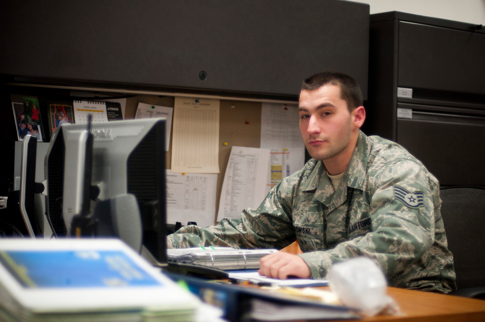 YOKOTA AIR BASE, Japan -- Staff Sgt. John Sadowski, 374th Maintenance Squadron aircraft fuels systems technician, sits at his desk here April 4, 2011. Sergeant Sadowski is a native of Milwaukee, Wis. (U.S. Air Force photo/Staff Sgt. Chad C. Strohmeyer)