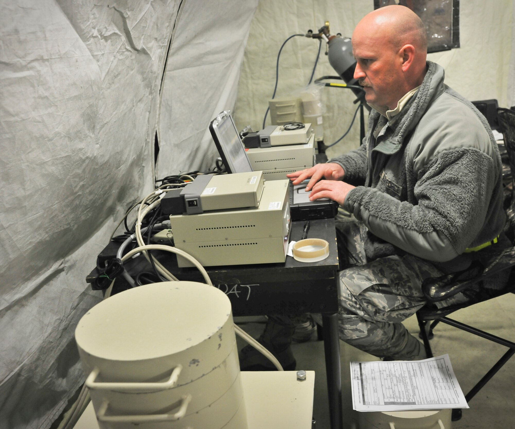 YOKOTA AIR BASE, Japan -- Master Sgt. Ty Richards, Air Force Radiation Assessment Team member, tests local water samples for radiation here March 25. The AFRAT currently supports Operation Tomodachi by ensuring drinking water is safe for use.  (U.S. Air Force photo/Airman 1st Class Andrea Salazar)