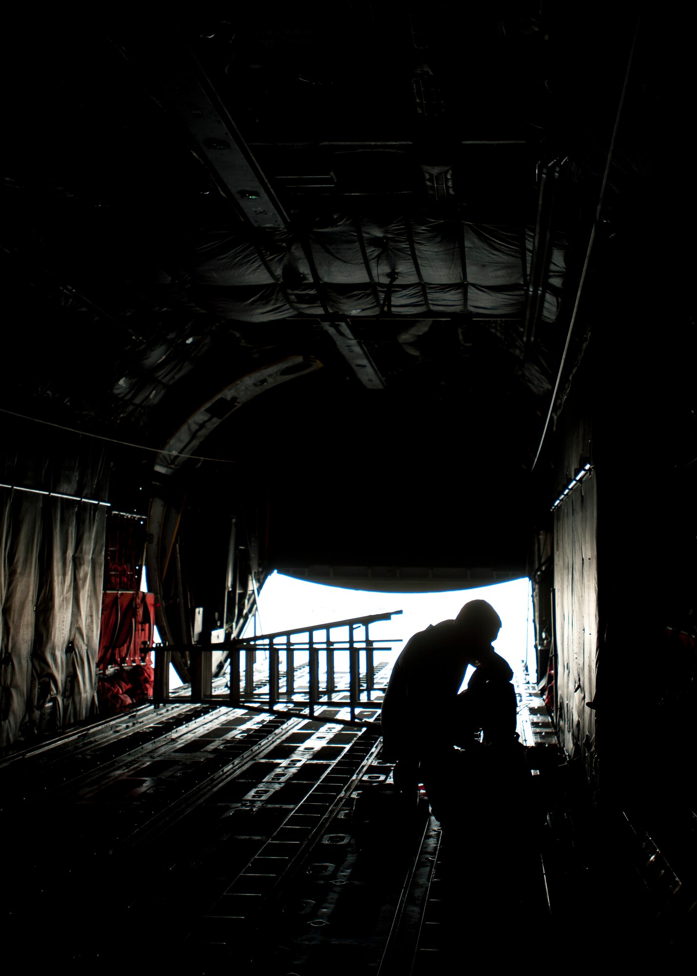 YOKOTA AIR BASE, Japan -- Senior Airman Bruce Quillen, 374th Aircraft Maintenance Squadron crew chief, checks the landing gear on a C-130 Hercules here April 2. In support of Operation Tomodachi, maintainers have worked extended hours to make sure all aircraft are ready for the relief effort. (U.S. Air Force photo/Staff Sgt. Chad C. Strohmeyer)