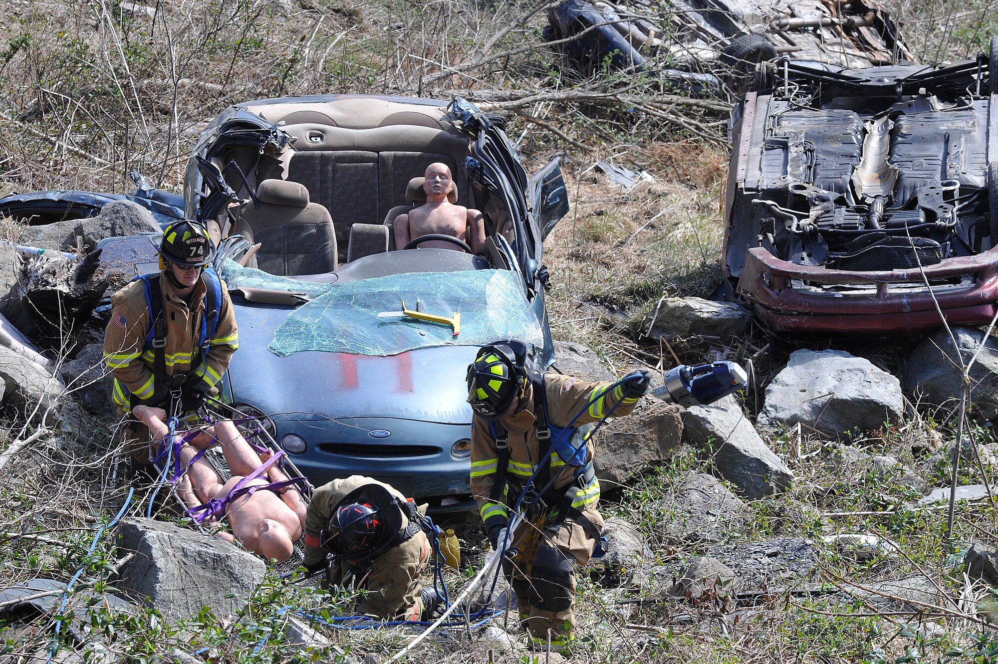 Members of the 11th Civil Engineer Squadron fire department perform a high angle auto extrication as part of their specialized training exercises at Black Flag in Gallagher W. Va., March 29. Black Flag is held annually at the Center for National Response which is a specialized facility for emergency management teams, run by the Joint Interagency Training and Education Center. (U.S. Air Force photo/ Senior Airman Melissa V. Brownstein)