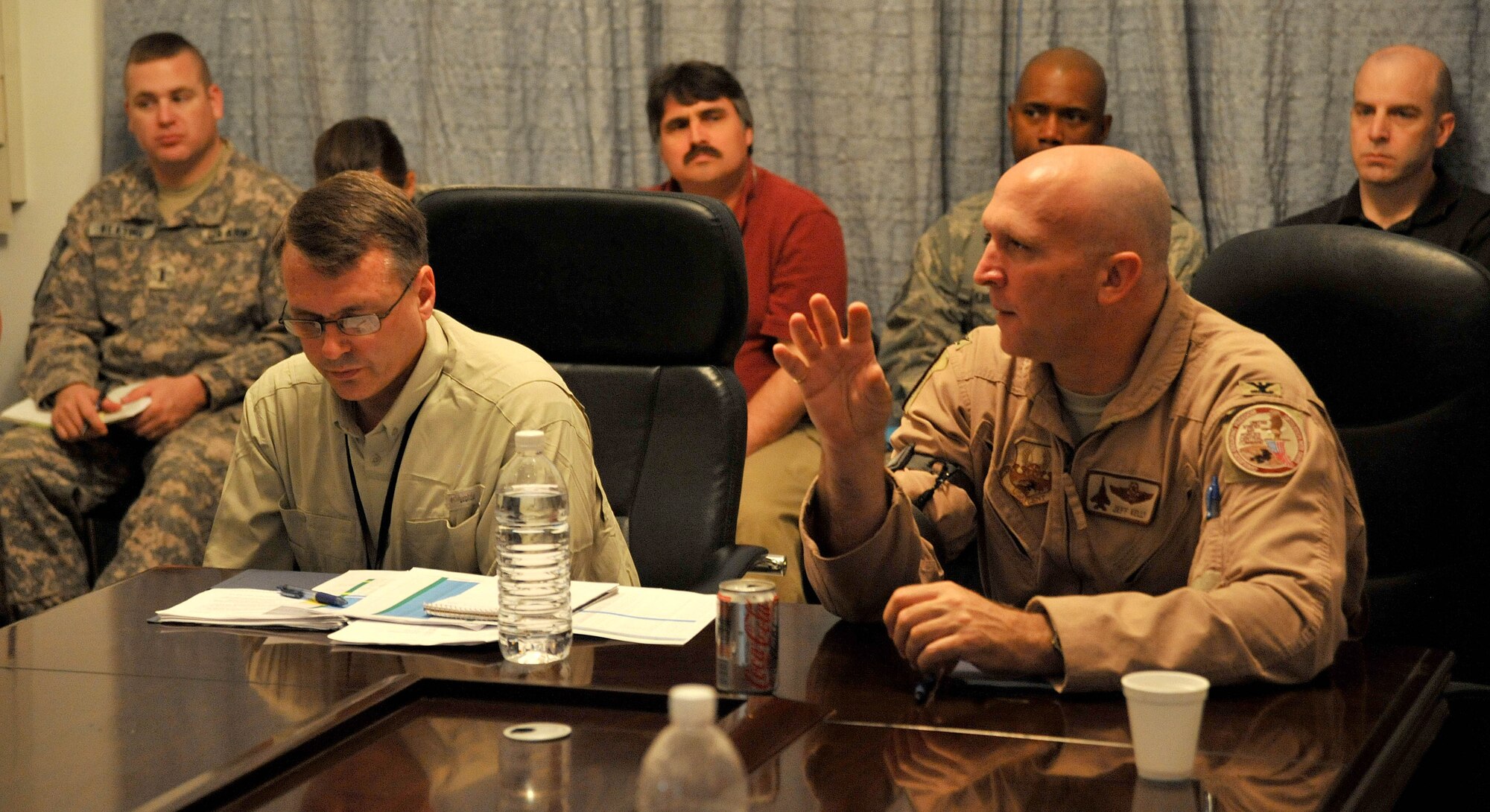 U.S. Air Force Col. Jeffrey Kelly, U.S. Air Forces Central, Shaw Air Force Base,  S.C., discusses a manpower issue directly with a roomful of U.S. Army and Air Force leaders, March 22, 2001, Victory Base Complex, Iraq. USAFCENT officials plan to hold a similar conference each quarter. (U.S. Air Force photo by Senior Airman Andrew Lee/Released)