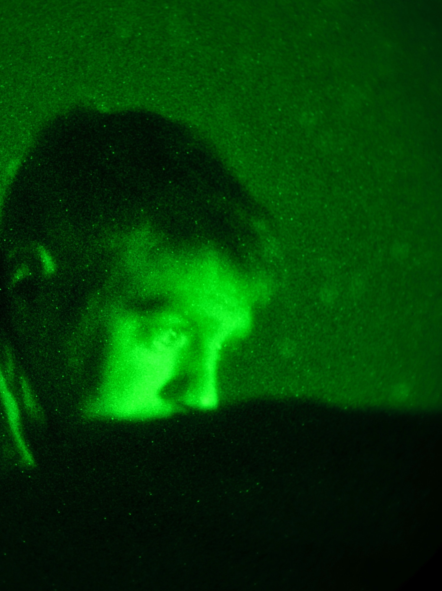 Tech. Sgt. Jonathan Oliver, a joint terminal attack controller assigned to Bagram Airfield’s 817th Expeditionary Air Support Operations Squadron, communicates with an F-16 Fighting Falcon pilot while watching a live feed of the aircraft's targeting pod during Operation Bull Whip in Laghman province, Afghanistan, March 27, 2011. (U.S. Air Force photo by Capt. Erick Saks)