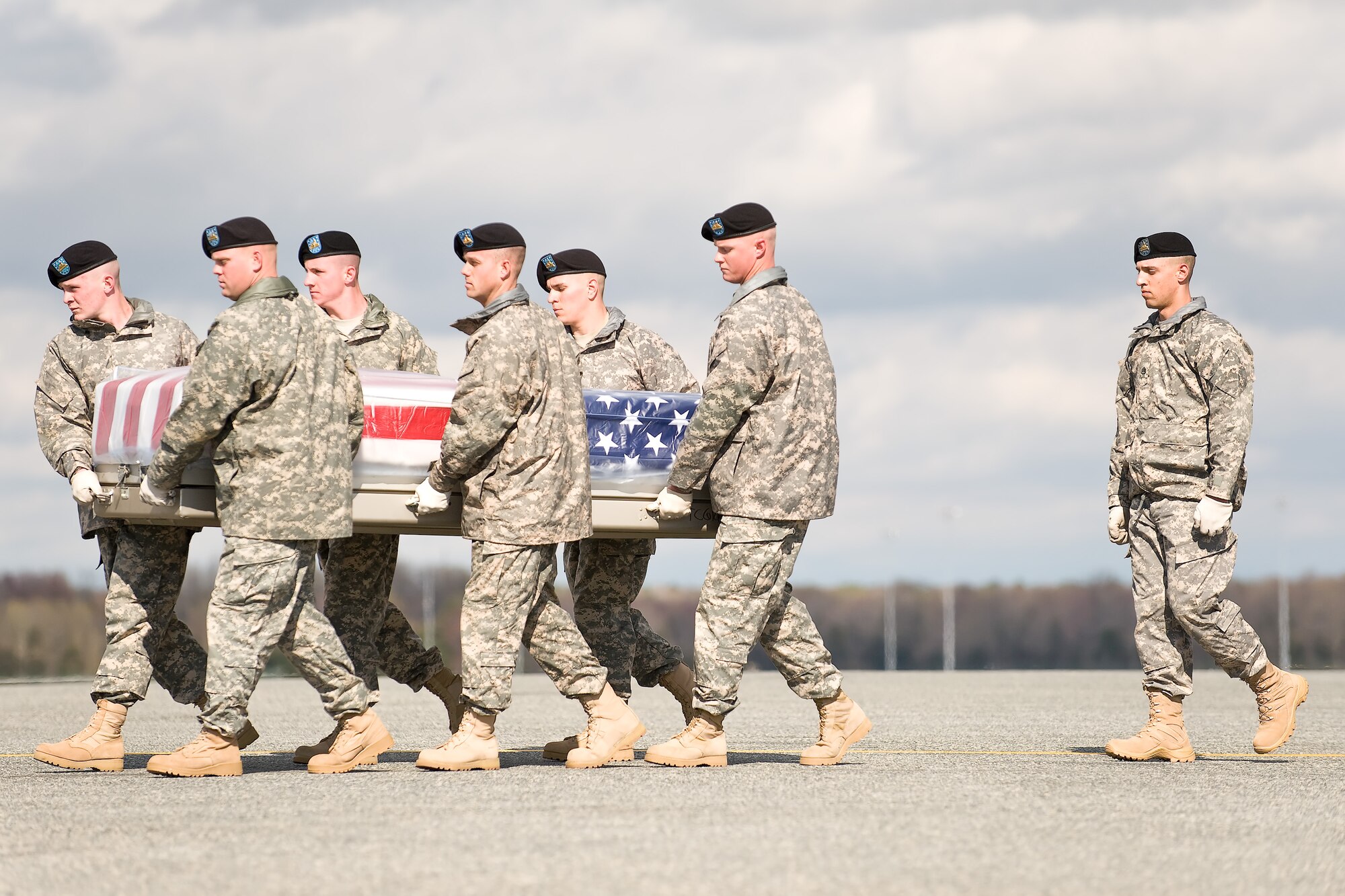 A U.S. Army carry team transfers the remains of Army Sgt. Jorge A. Scatliffe, of St. Croix, U.S. Virgin Islands, at Dover Air Force Base, Del., April 5, 2011. Scatliffe was assigned to the 27th Brigade Support Battalion, 4th Brigade Combat Team, 1st Cavalry Division, Fort Hood, Texas. (U.S. Air Force photo/Roland Balik)
