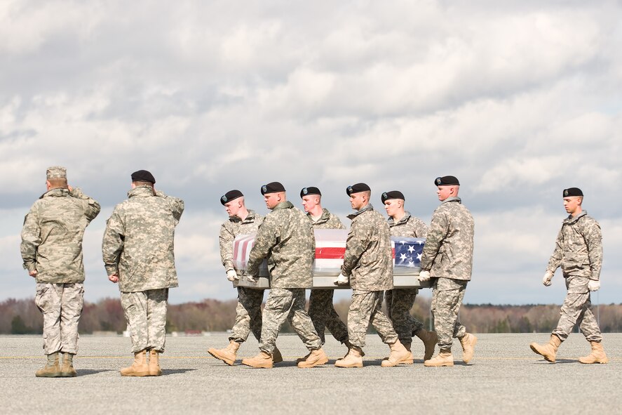 A U.S. Army carry team transfers the remains of Army Sgt. Christian A. Garcia, of Goodyear, Ariz., at Dover Air Force Base, Del., April 5, 2011. Garcia was assigned to Fort Hood, Texas. (U.S. Air Force photo/Roland Balik)