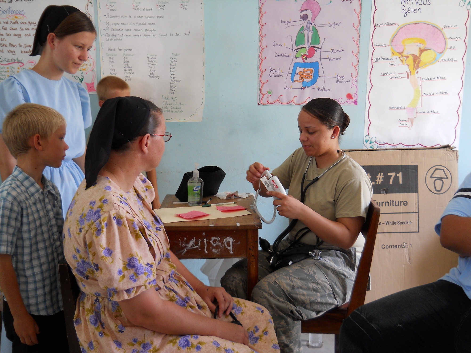 Senior Airman Tara Hickman, 459th Aerospace Medicine Squadron aerospace medicine technician, takes vital signs and temperature readings for residents of a village in Belize on April 1. Airman Hickman joined other Reserve servicemembers from the 459th Air Refueling Wing at Joint Base Andrews, Md., to particpate in a Medical Readiness Training Exercise from March 26 to April 9. The MEDRETE is designed to bring humanitarian assistance and free medical care to its host country citizens. Over 42 medical professionals from units across the U.S. Air Force participated this year in the joint exercise. (Submitted U.S. Air Force photo)