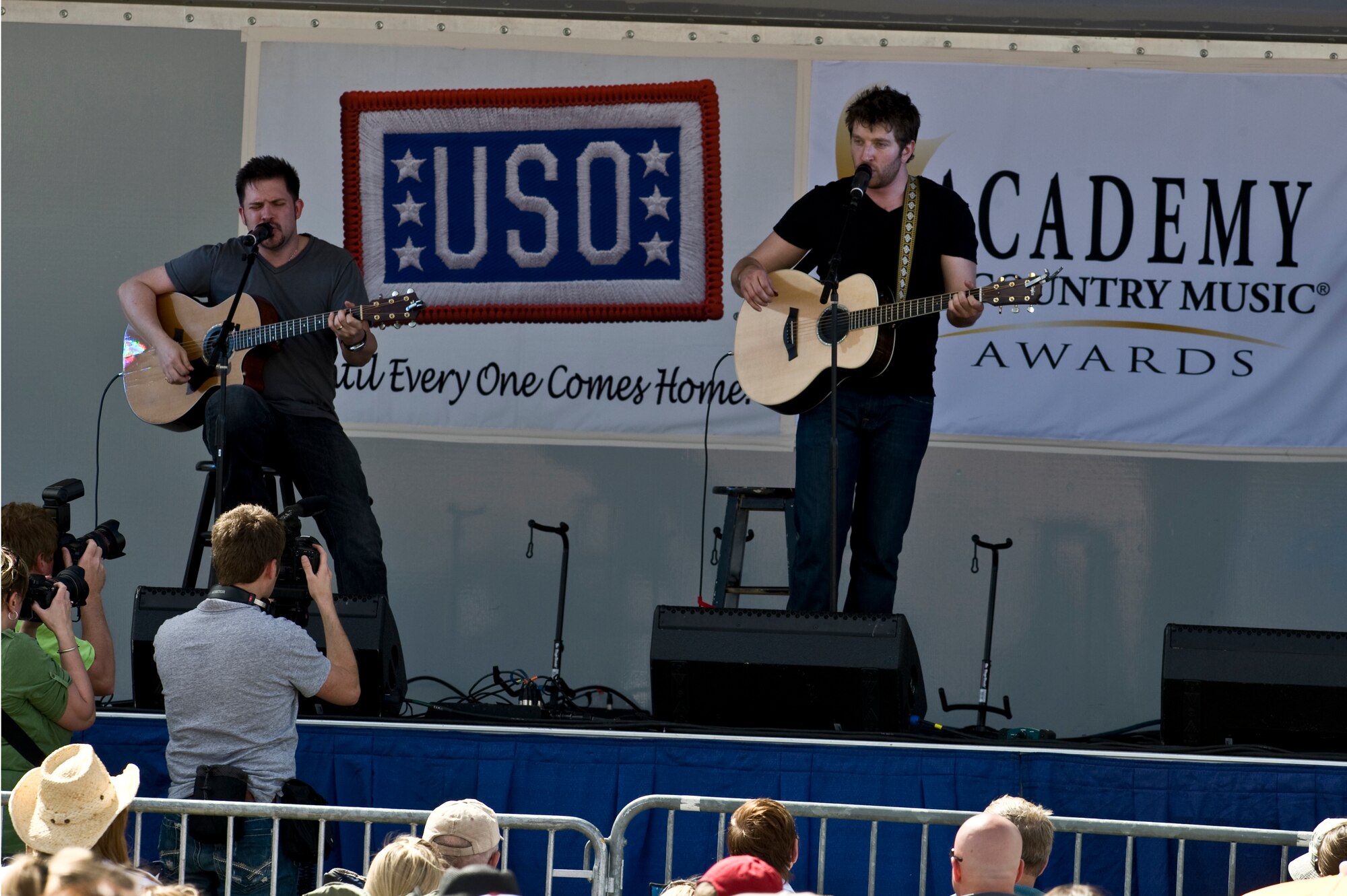 NELLIS AIR FORCE BASE, Nev. -- Country singer, Brett Eldredge performs "Raymond" onstage during the Academy of Country Music USO concert at the Nellis sports pavilion April 2. Country music stars came to Nellis to participate in a charity skeet shooting event and perform a free concert for military members and their families. ( U.S Air Force Photo by Airman 1st Class Daniel Hughes)