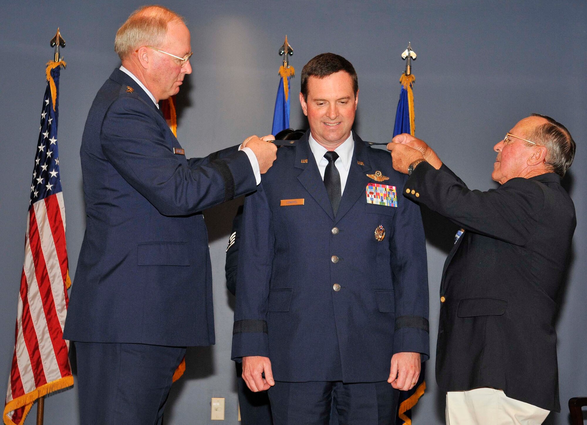 Gen. Craig McKinley, National Guard Bureau chief, and retired Air Force Lt. Col. Lauren Lengyel pin on Maj. Gen. Joseph Lengyel’s second star during his promotion ceremony at Tyndall Air Force Base, Fla., April 1. General Lengyel is the 1st Air Force (Air Forces Northern) vice commander. (U.S. Air Force photo by Lisa Norman)