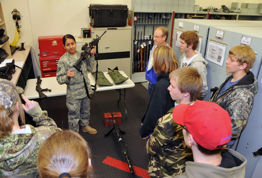 OFFUTT AIR FORCE BASE, Neb. -- Staff Sgt. Tracy Howard, NCO in charge of the 55th Security Forces Squadron armory, takes a question from a St. Mary's High School student inside the armory here March 24. Eight students from St. Mary's High School in Kansas visited the armory as part of a base tour. U.S. Air Force Photo by Jeff W. Gates