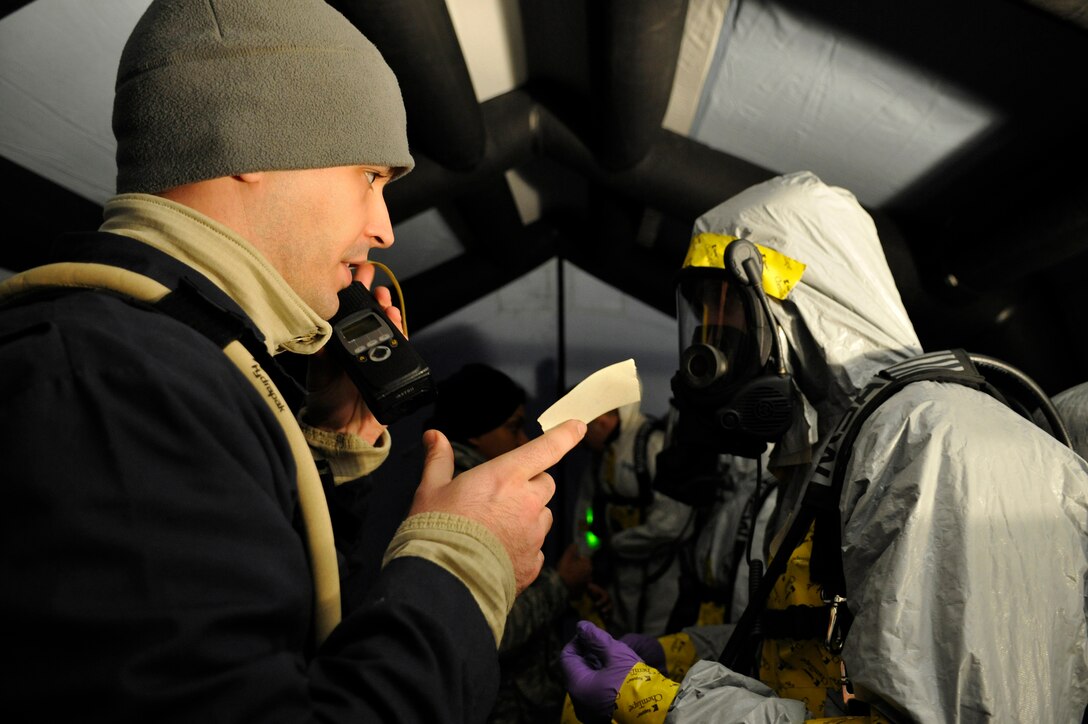 1st Lieutenant John Burg, 11th Civil Engineer Squadron emergency management, updates the incident commander on current operation during exercise Black Flag at the  Center for National Response in Gallagher W. Va, March 31. Members from the 79th Medical Wing, 11th Civil Engineer Squadron and Air Force District of Washington participate in five days of exercises each year to sharpen their chemical, radiological, nuclear or high-yield explosive readiness skills. (U.S. Air Force photo by Senior Airman Melissa V. Brownstein)