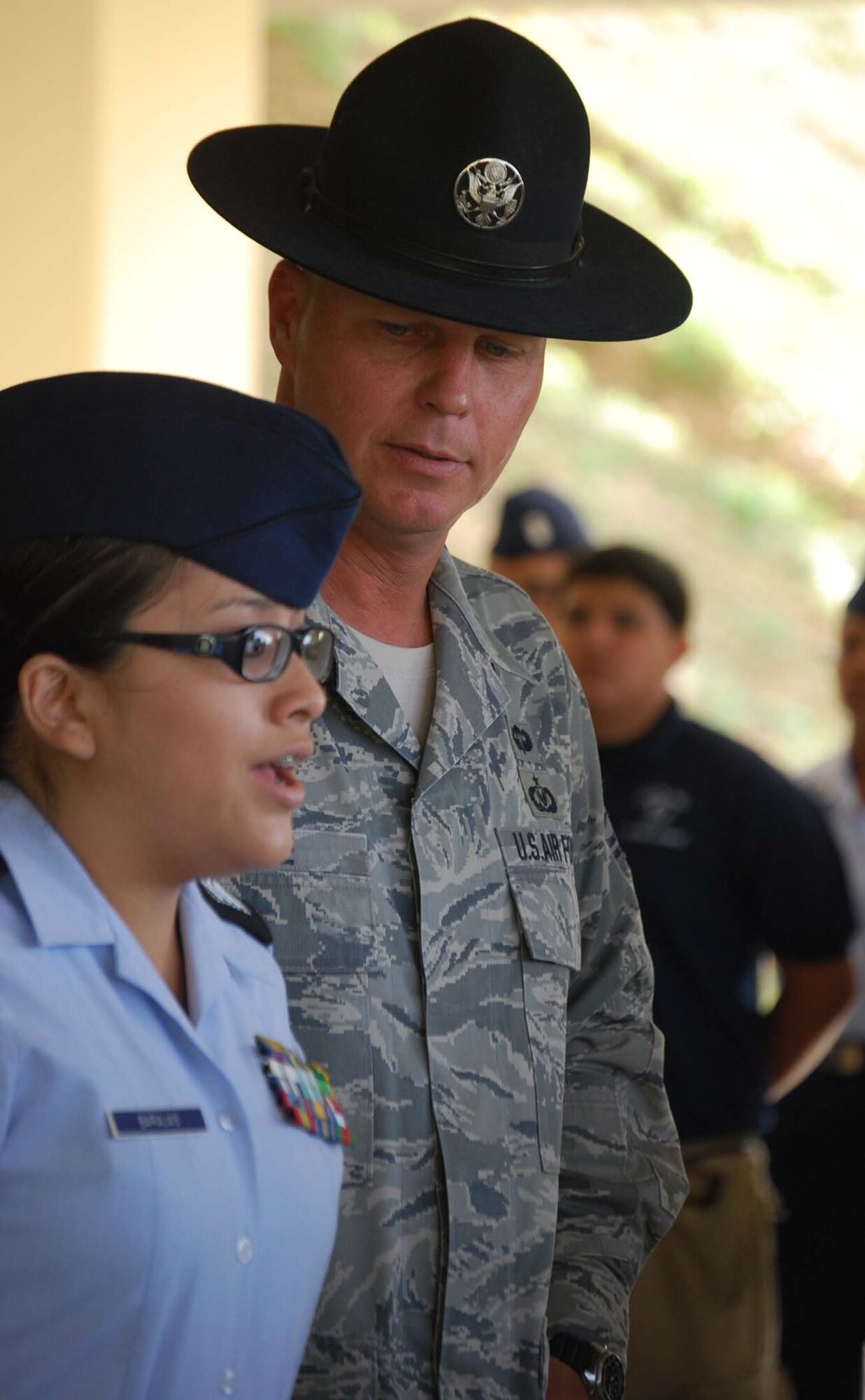Master Sergeant Terrance Thoe, a 433rd military training instructor, looks on as a cadet reports to him during the 13th annual JROTC day held at the Alamo Wing. This year's visit included a C-5 visit, an aeromedical evacuation lesson, and a visit to a cargo load training site. (U.S. Air Force photo/ Senior Airman Viola M. Hernandez)  