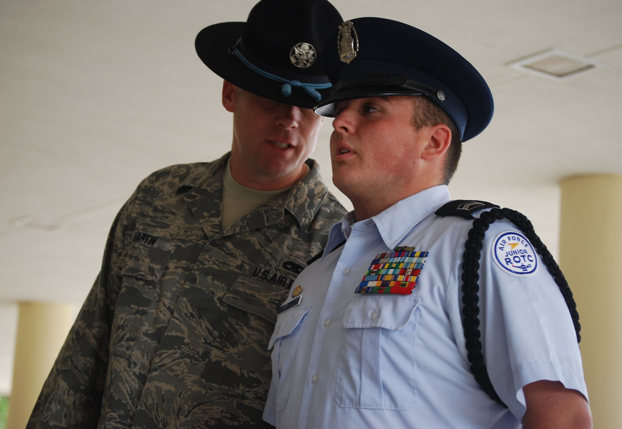 Master Sergeant Frank Martin, a 433rd Military Training Instructor, gives a cadet commander from Southside High School feedback on how to address his flight during the 13th annual Junior ROTC day held at the Alamo Wing. (U.S. Air Force photo/ Senior Airman Viola M. Hernandez)