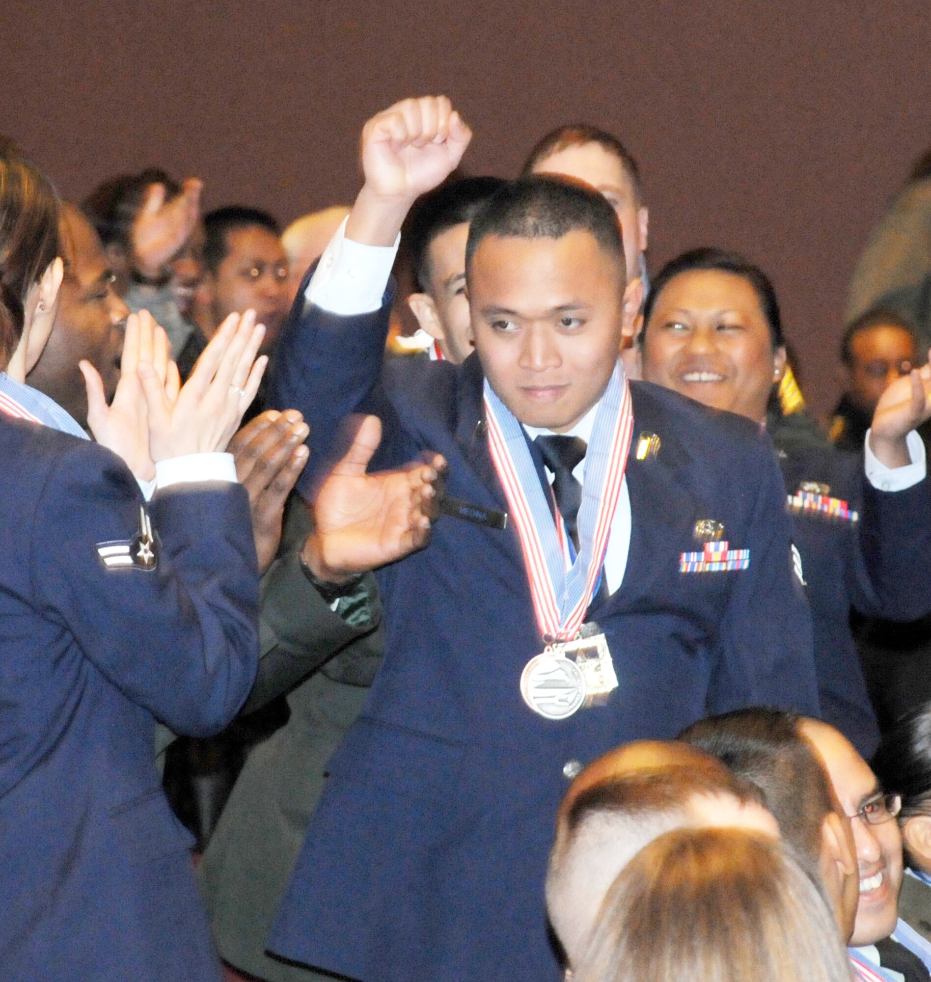 Senior Airman Ghil Medina, Joint Base Langley-Eustis, Va., celebrates after being named Junior Chef of the Year March 11, at the 36th Annual Culinary Arts Competition awards ceremony at Fort Lee, Va. Airman Medina is the first Airman to win the title, which is traditionally held by the Army. The annual culinary competition showcases the talents of U.S. Armed Forces food specialists from worldwide.