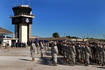 Men and women of the 94th Airlift Wing stand in formation to honor Chief Master Sgt. John M. Anderson, 94th Airlift Wing Command Chief, on the day of his retirement, Apr 3.  Chief Anderson retires after 33 years of active and reserve Air Force duty.   (U.S. Air Force photo/ Brad Fallin)