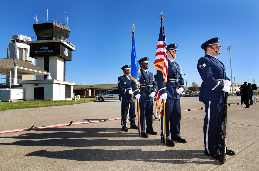Members of the 94th Airlift Wing Honor Guard standby to post the colors for the 94th Airlift Wing Command Chief, Chief Master Sgt. John M. Anderson's retirement ceremony, Apr 3.  Chief Anderson retires after 33 years of active and reserve Air Force duty.   (U.S. Air Force photo/ Brad Fallin)