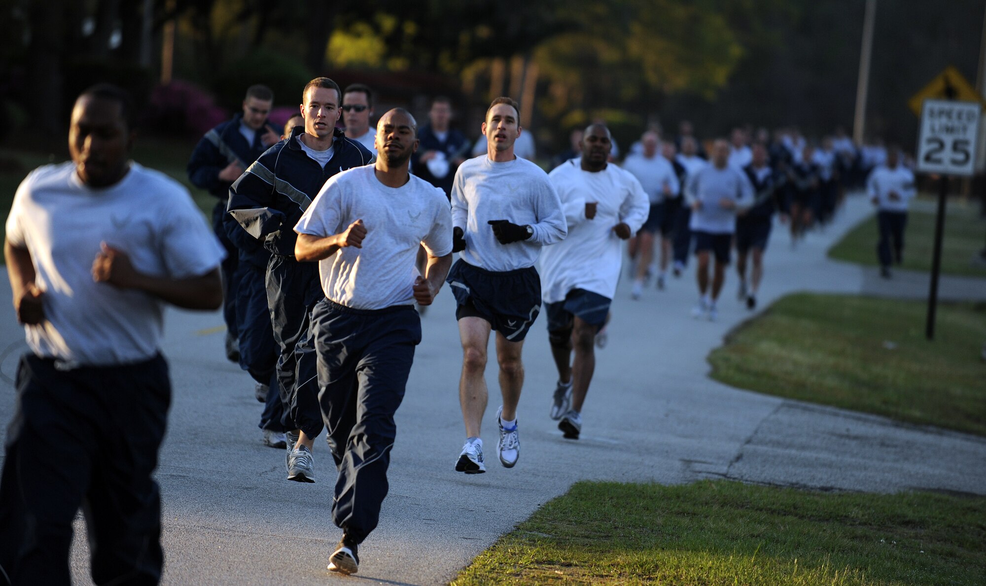 Members of Joint Base Charleston pace themselves as they near the three-quarter-mile mark of the Commander's Fitness Run April 1, 2011, on Joint Base Charleston, S.C. This month's fitness run was held to raise awareness of both sexual assault and rape. (U.S. Air Force photo/Senior Airman Timothy Taylor)(Released)