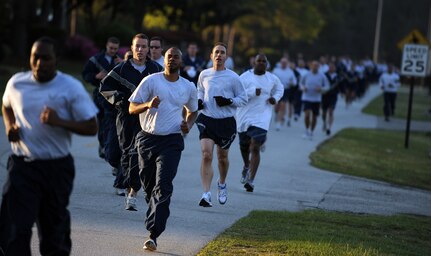 Members of Joint Base Charleston pace themselves as they near the three-quarter-mile mark of the Commander's Fitness Run April 1, 2011, on Joint Base Charleston, S.C. This month's fitness run was held to raise awareness of both sexual assault and rape. (U.S. Air Force photo/Senior Airman Timothy Taylor)(Released)