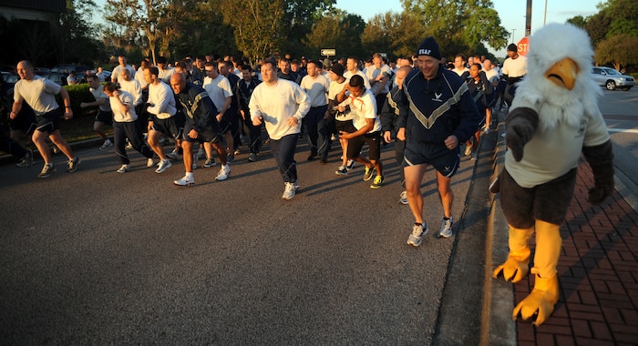 Airmen dash off as Ernie the Eagle signals the start of the run during the Commander's Fitness Run April 1, 2011 on Joint Base Charleston, S.C. Ernie is the mascot for the 1st Combat Camera squadron on Joint Base Charleston. (U.S. Air Force photo/Senior Airman Timothy Taylor)
(Released)