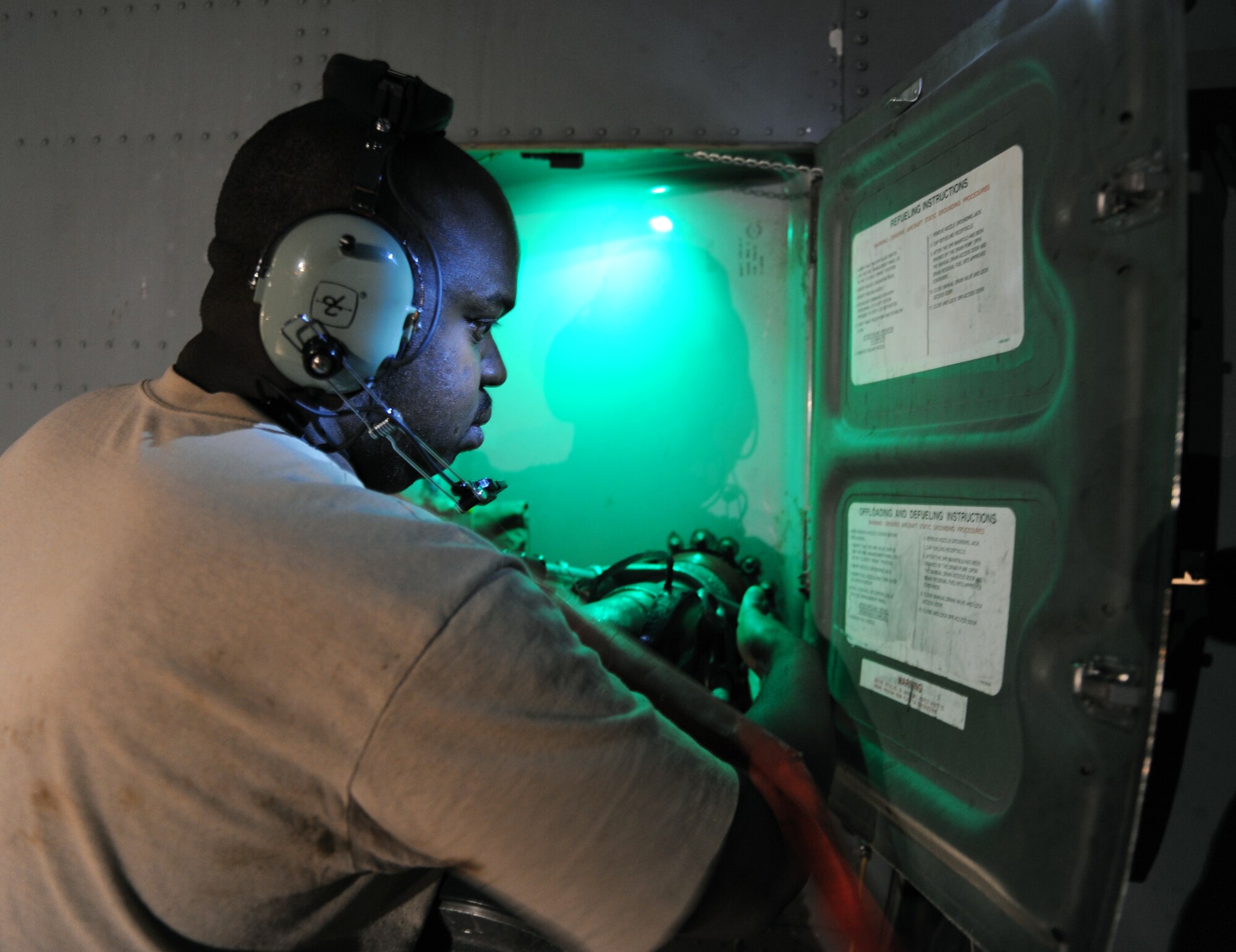 Senior Airman Meredith Williams, a 19th Component Maintenance Squadron fuel ship journeyman, defuels a Hercules C-130 on the flightline at Little Rock Air Force Base, Ark. The defueling process is done occasionally to decontaminate it. (Air Force photo by Airman 1st Class Ellora Stewart)