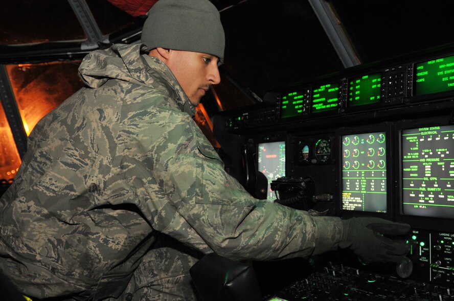 Airman 1st Class Christopher Loggins, a 314th Aircraft Maintenance Squadron crew chief, lowers the flaps of a C-130 Hercules during a pre-flight inspection March 25, 2011, at Little Rock Air Force Base, Ark. One of the reasons the flaps are lowered during a pre-flight inspection is to ensure free and correct movement. (U.S. Air Force Photo/Airman 1st Class Rusty Frank)