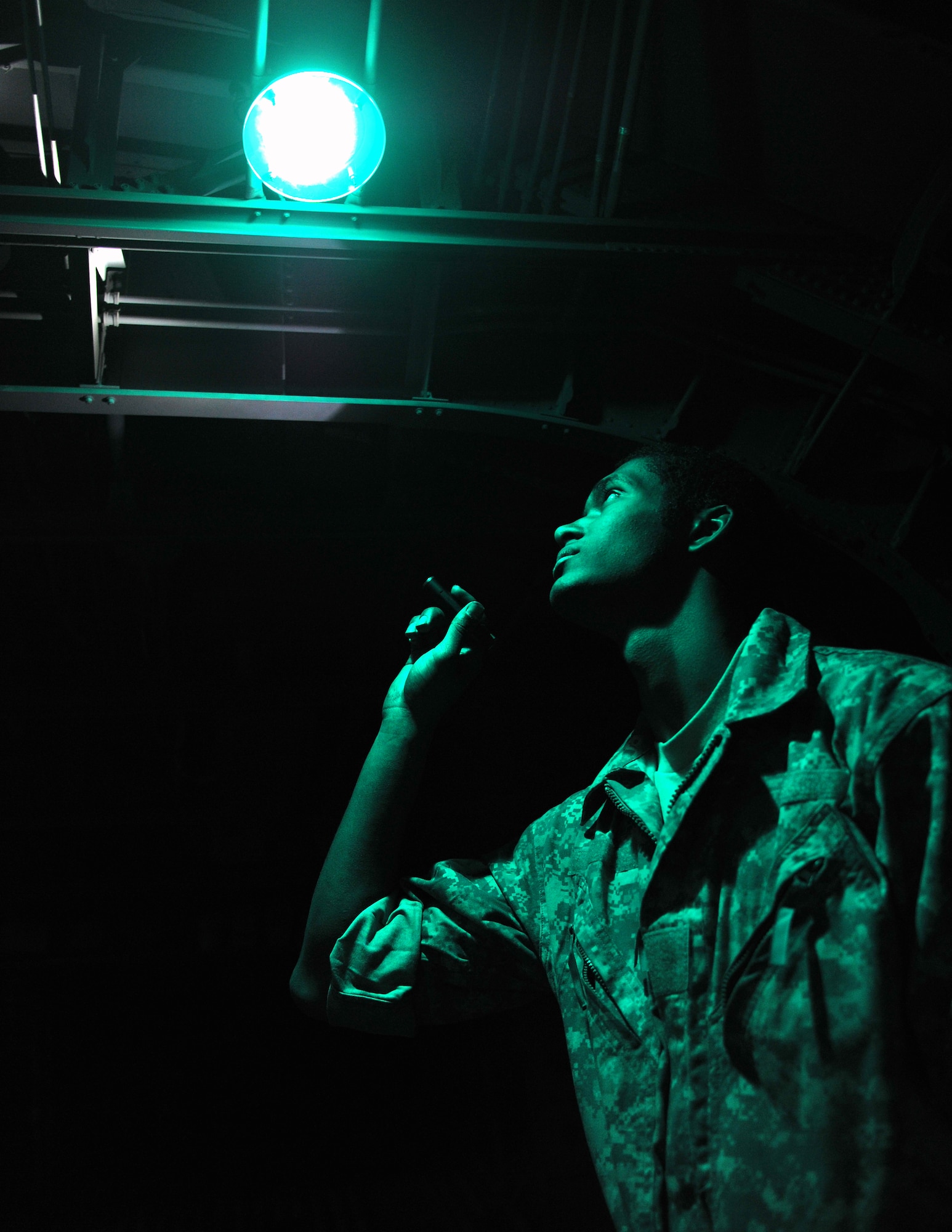 Senior Airman Bruce Allen, a 19th Aircraft Maintenance Squadron crew chief, performs a pre-flight check on the cargo deck of a C-130 Hercules March 24, 2011, on the flightline of Little Rock Air Force Base, Ark.  Airman Allen, along with other crew members, keeps the base aircraft flying the largest C-130 transport mission in the world. (U.S. Air Force photo by Staff Sgt. Chris Willis)