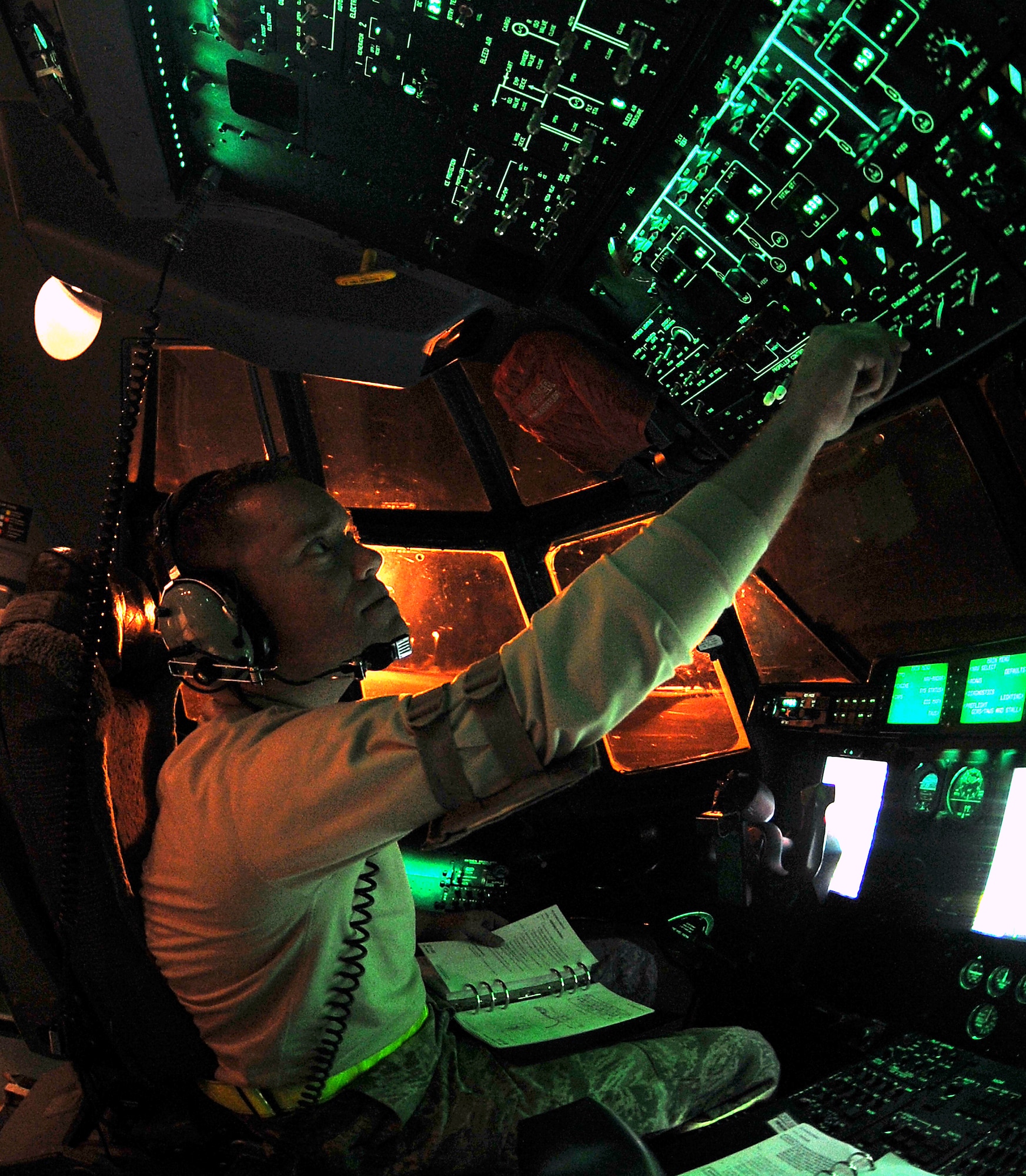 Staff Sgt. Troy Miller, a 19th Component Maintenance Squadron panel operator, checks the balance level of a C-130’s fuel tanks from the flight deck March 24, 2011, at Little Rock Air Force Base, Ark.  Sergeant Miller checks the panels to make sure all tanks are draining equally during the fuel decontamination to ensure safety of the aircraft and all Airmen involved in the process. (U.S. Air Force photo by Staff Sgt. Chris Willis)