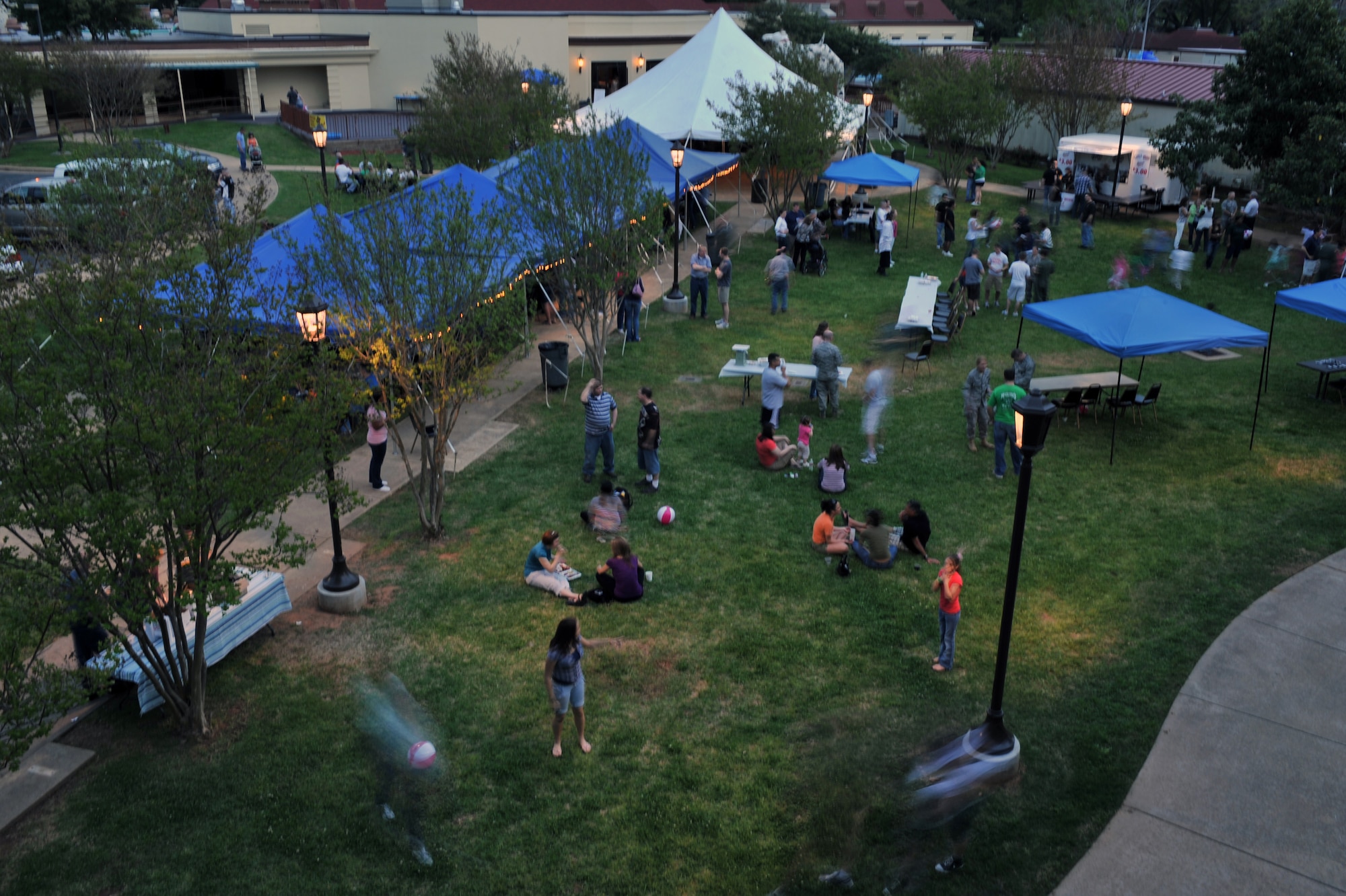 Patrons walk, talk, play and eat at the Crawfish Festival on Barksdale Air Force Base, La., April 1. Free food along with a crawfish eating contest, crawfish races, a live band and a moon bounce were some of the events held at the festival. (U.S. Air Force photo/ Airman 1st Class Micaiah Anthony)(RELEASED)