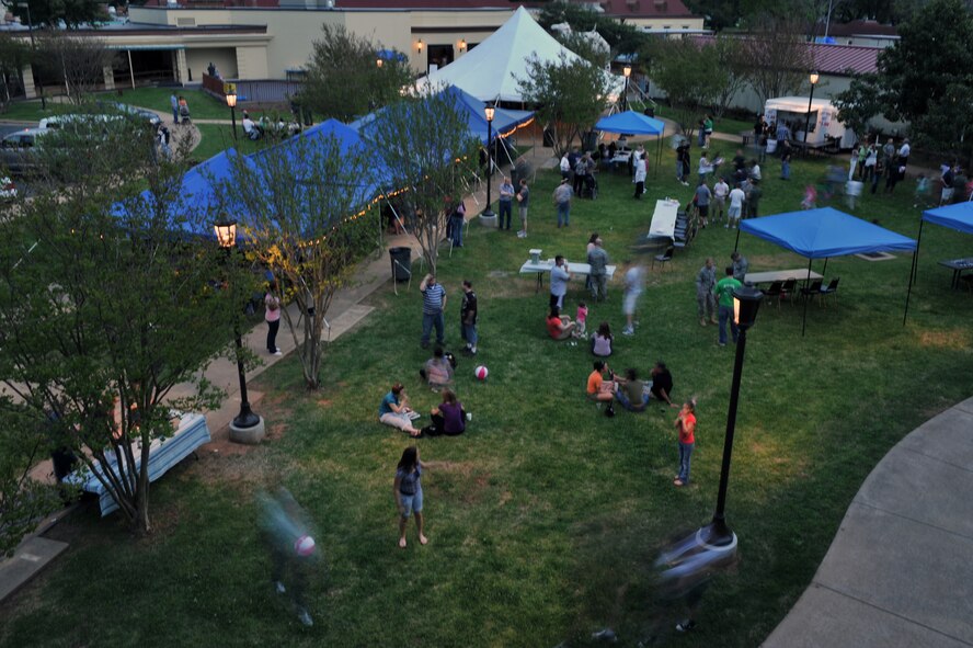 Patrons walk, talk, play and eat at the Crawfish Festival on Barksdale Air Force Base, La., April 1. Free food along with a crawfish eating contest, crawfish races, a live band and a moon bounce were some of the events held at the festival. (U.S. Air Force photo/ Airman 1st Class Micaiah Anthony)(RELEASED)