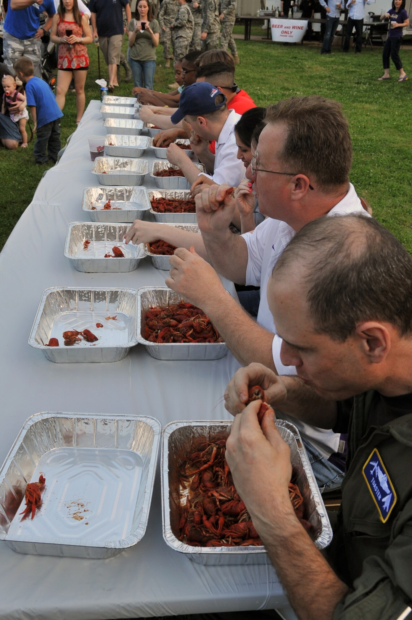 Contestants shell and eat crawfish during a crawfish eating contest on Barksdale Air Force Base, La., April  1. The contestants were given three minutes to eat two lbs. of crawfish. The winner was determined by the remaining weight of the crawfish shells. (U.S. Air Force photo/ Airman 1st Class Micaiah Anthony)(RELEASED)