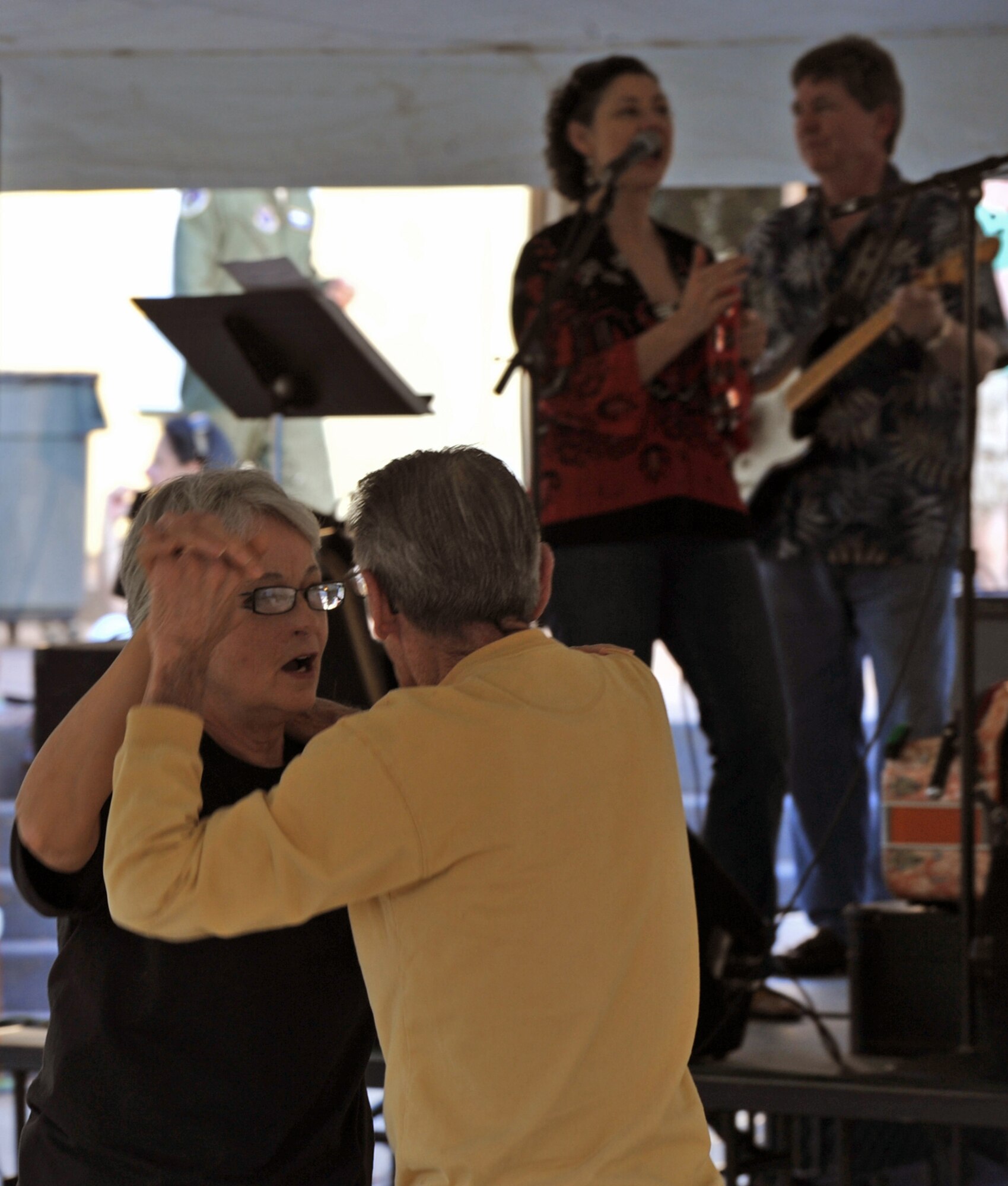 Susan Shelton, 2nd Bomb Wing, and John Shelton, retired Navy Boiler Tender 2nd Class, dance to music played by the Red River Playboys at the Crawfish Festival on Barksdale Air Force Base, La., April 1. Free food, along with a crawfish eating contest, crawfish races and a moon bounce were some of the events held at the festival. (U.S. Air Force photo/ Airman 1st Class Micaiah Anthony)(RELEASED)