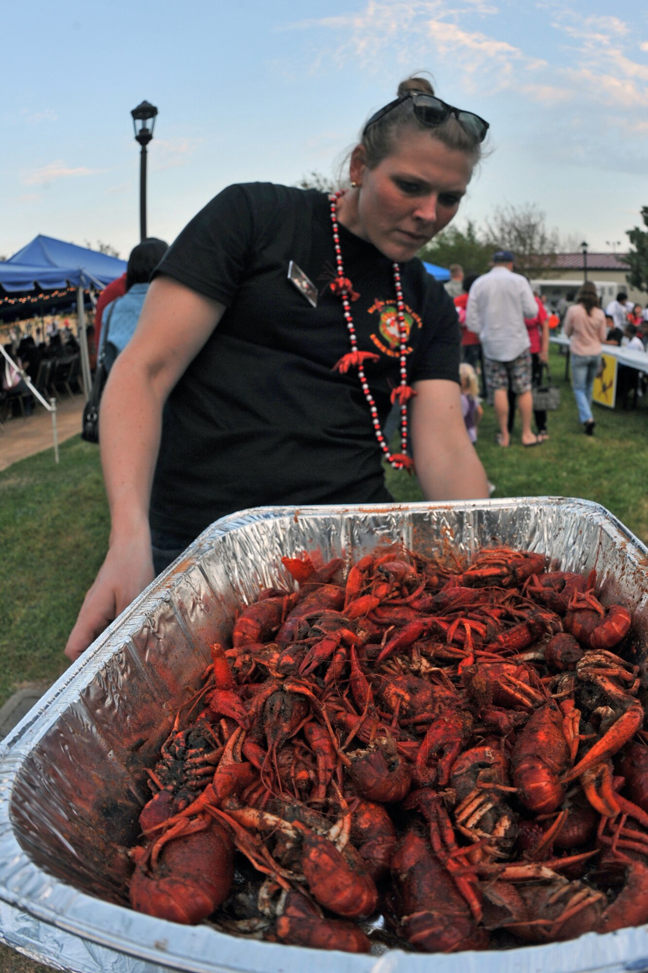 1st Lt. Olivia Korte, 2nd Force Support Squadron, weighs crawfish for a crawfish eating contest at the Crawfish Festival on Barksdale Air Force Base, La., April 1. The contestants were given three minutes to eat two lbs. of crawfish. The winner was determined by the remaining weight of the crawfish. (U.S. Air Force photo/ Airman 1st Class Micaiah Anthony)(RELEASED)